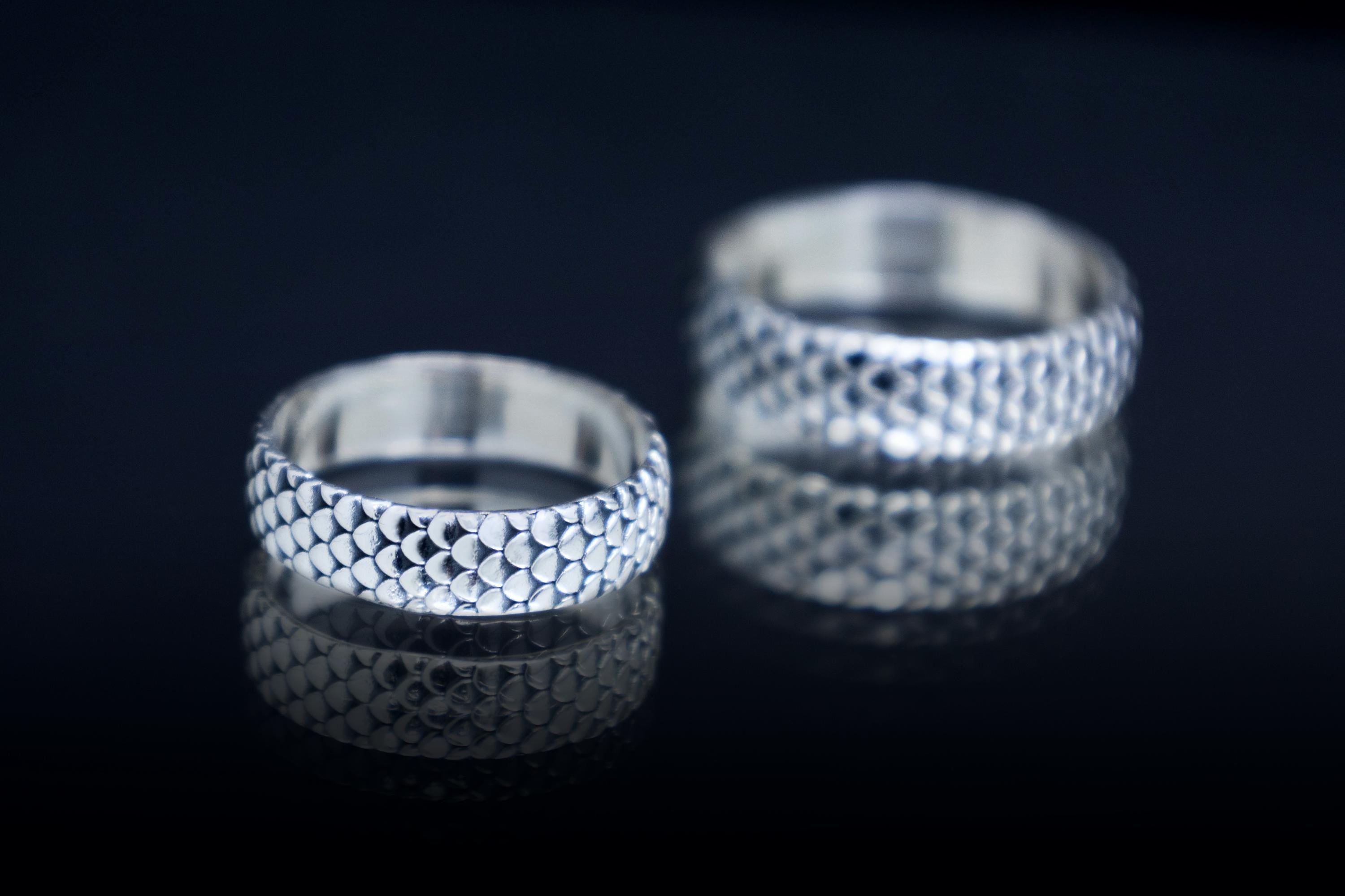 Dragon inspired silver ring with detailed scale texture