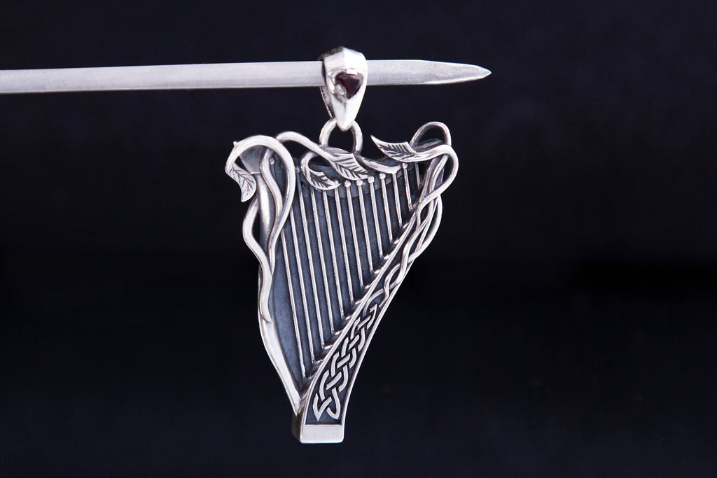 Celtic style harp necklace with trillion gemstone