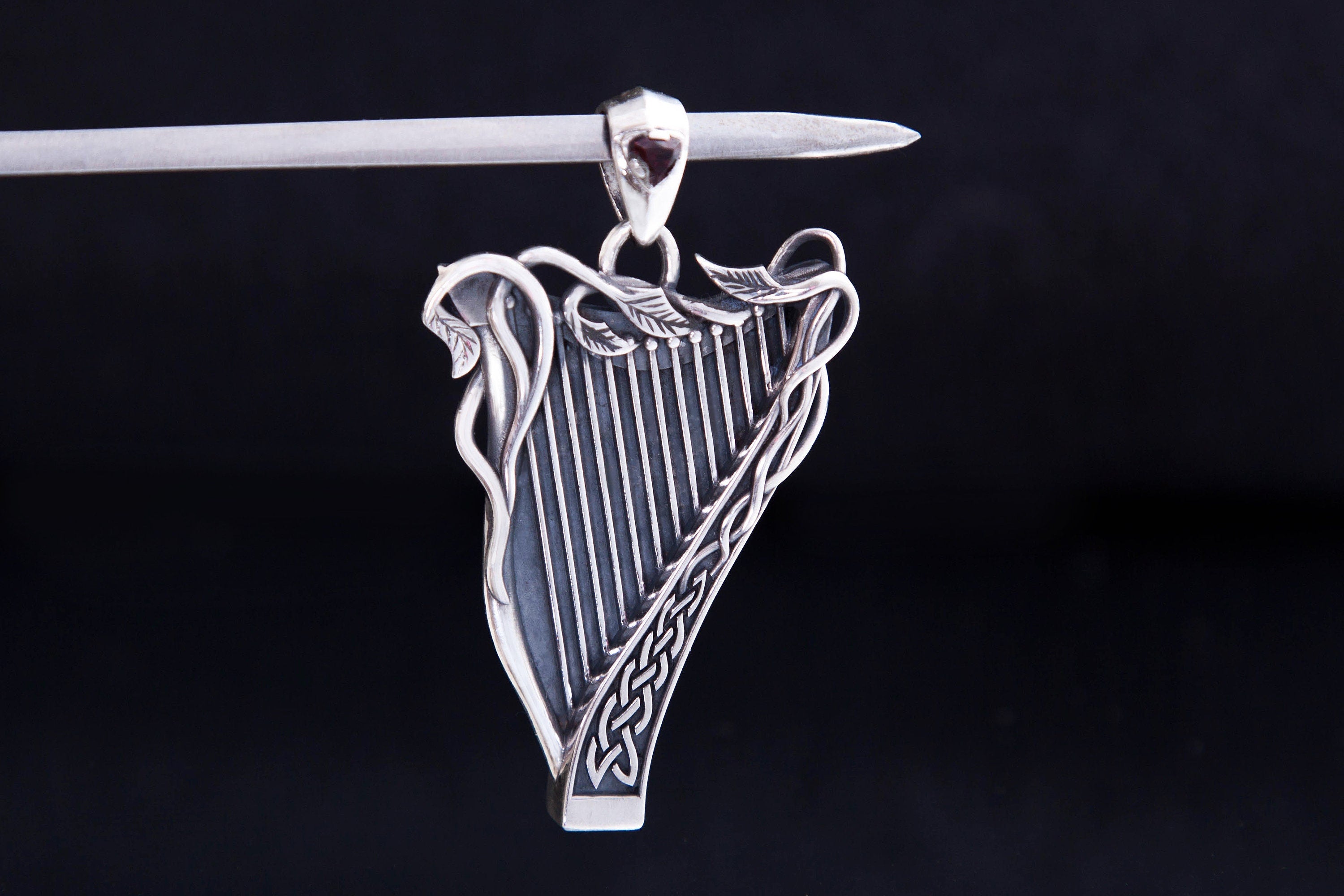 Celtic style harp necklace with trillion gemstone