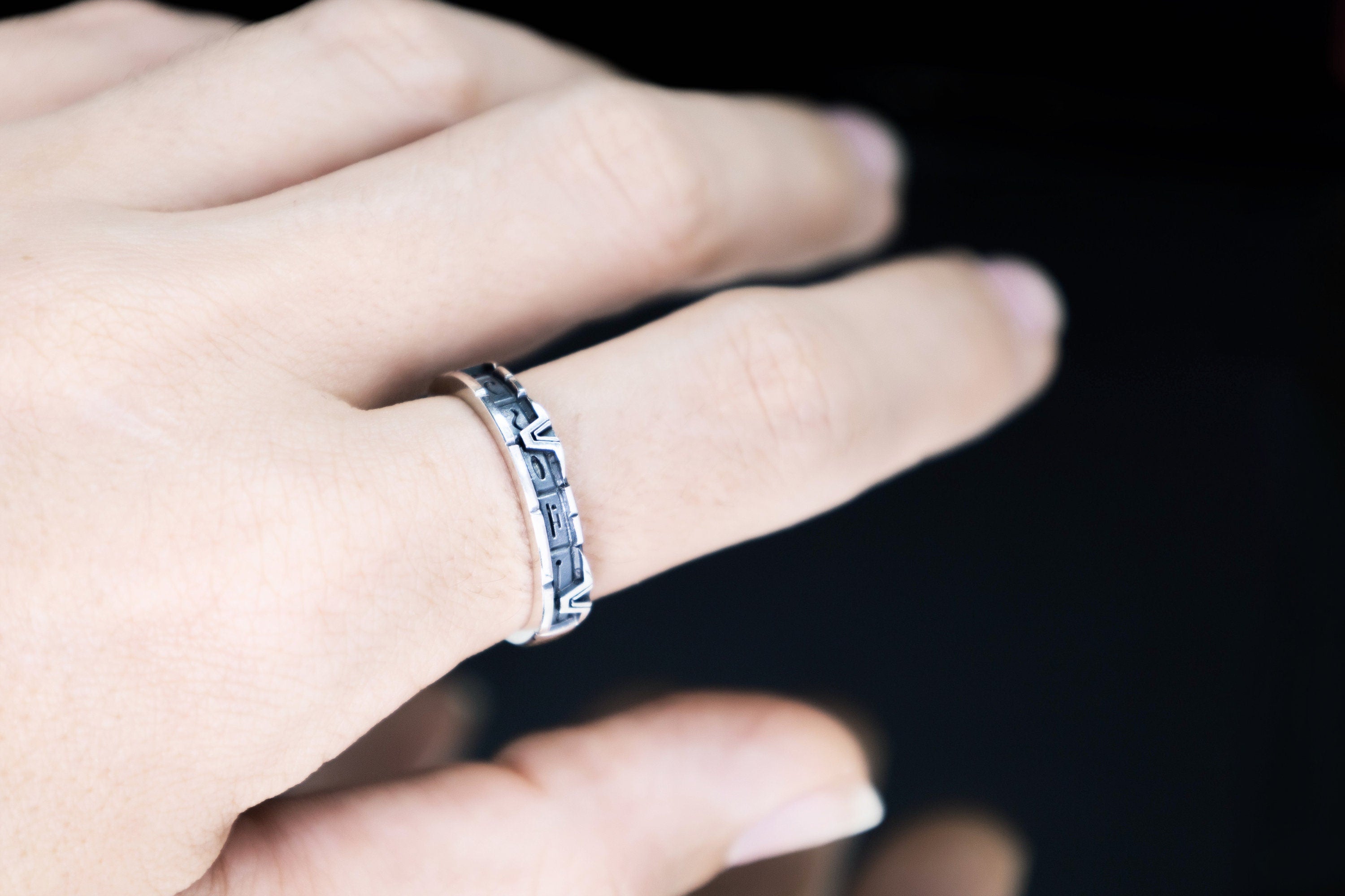 Unisex silver star gate portal glyph band worn on hand