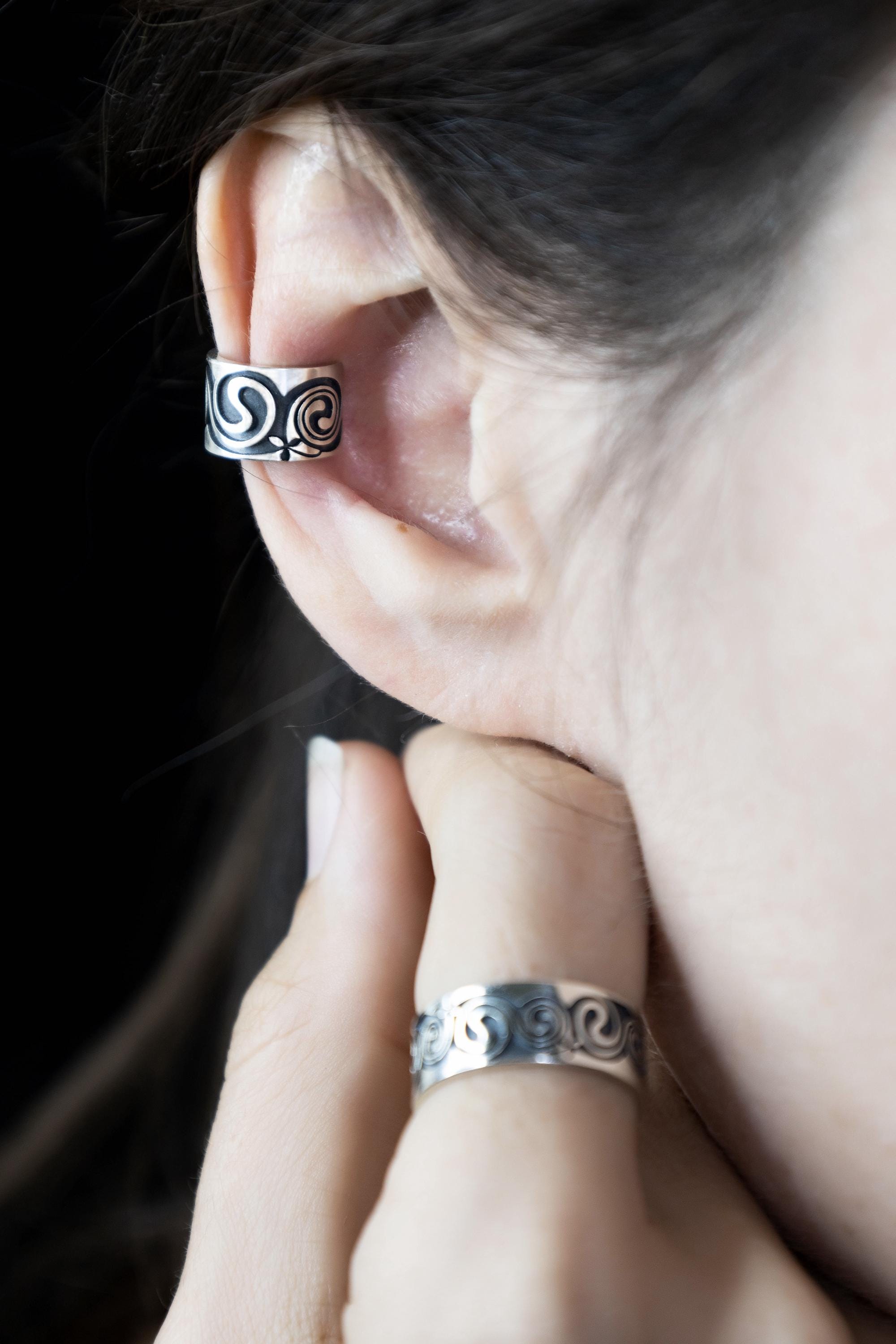 Handmade silver Celtic ear cuff shown on model