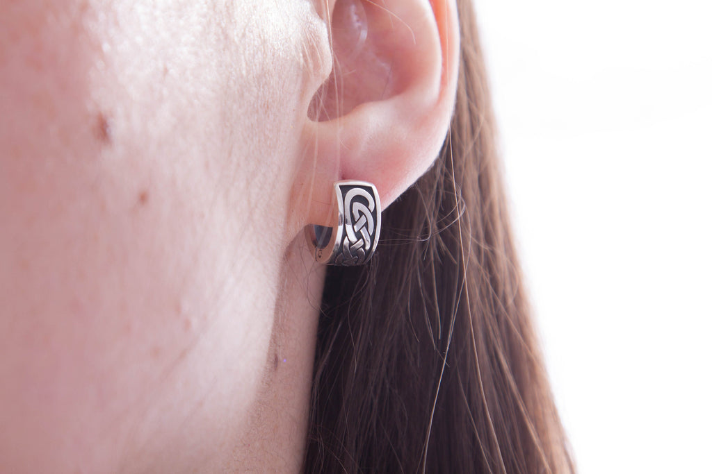 Celtic silver hoop earring worn on ear