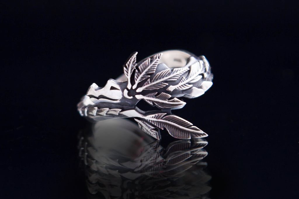 Aztec mythology jewelry ring with dragonlike sculptural form