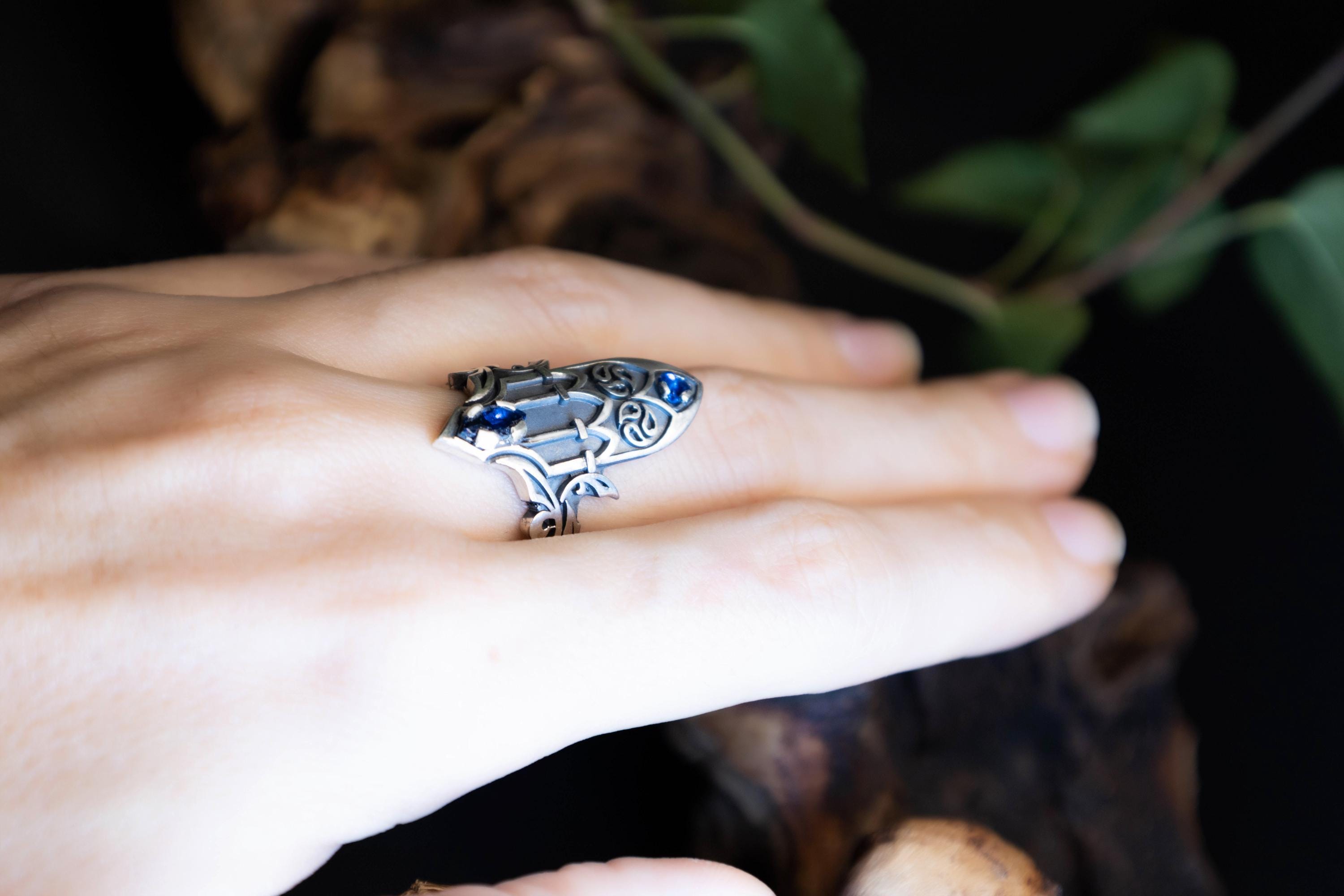 Blue gemstone cathedral gothic ring on hand