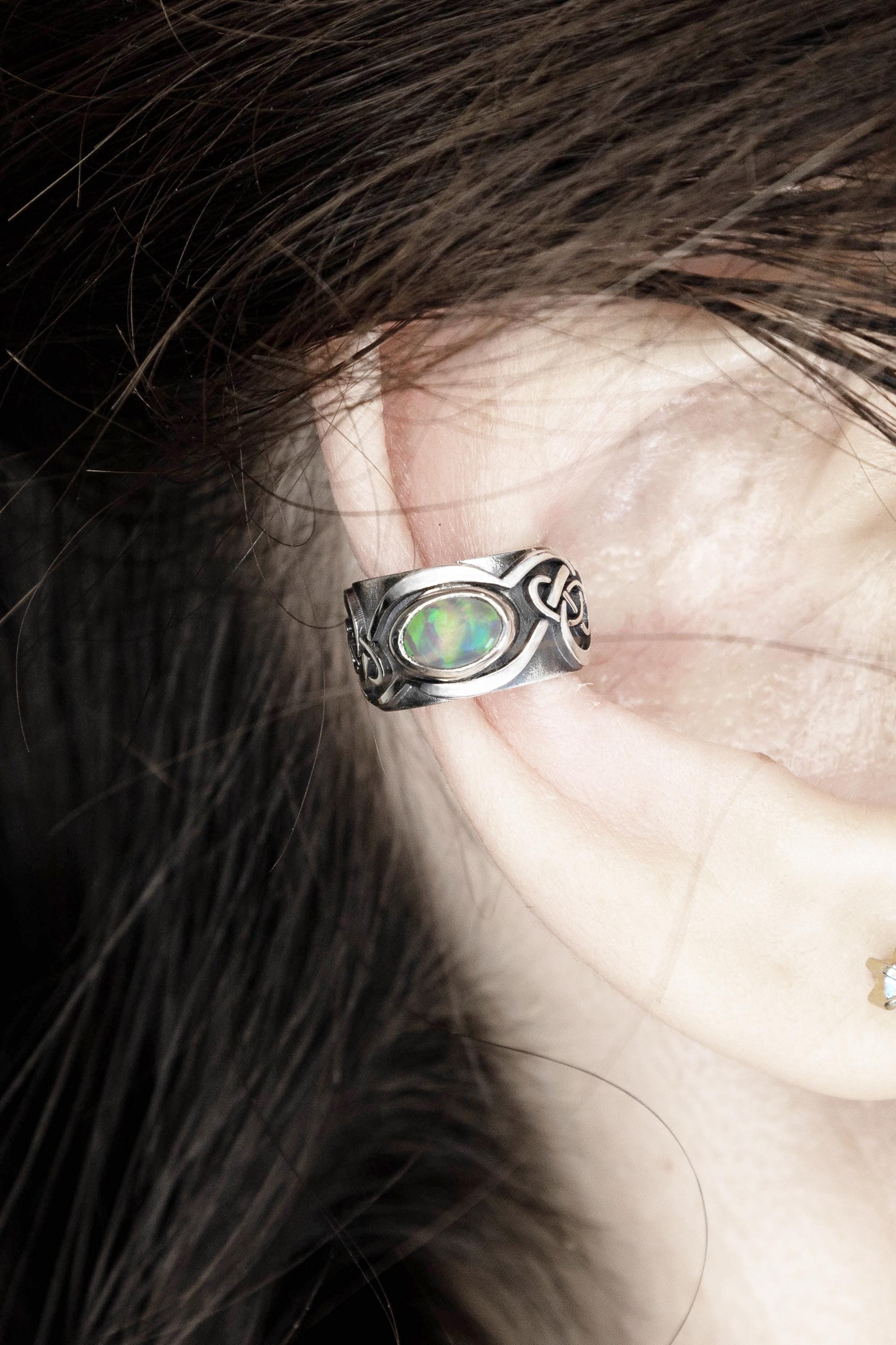 Wide opal ear cuff worn on ear