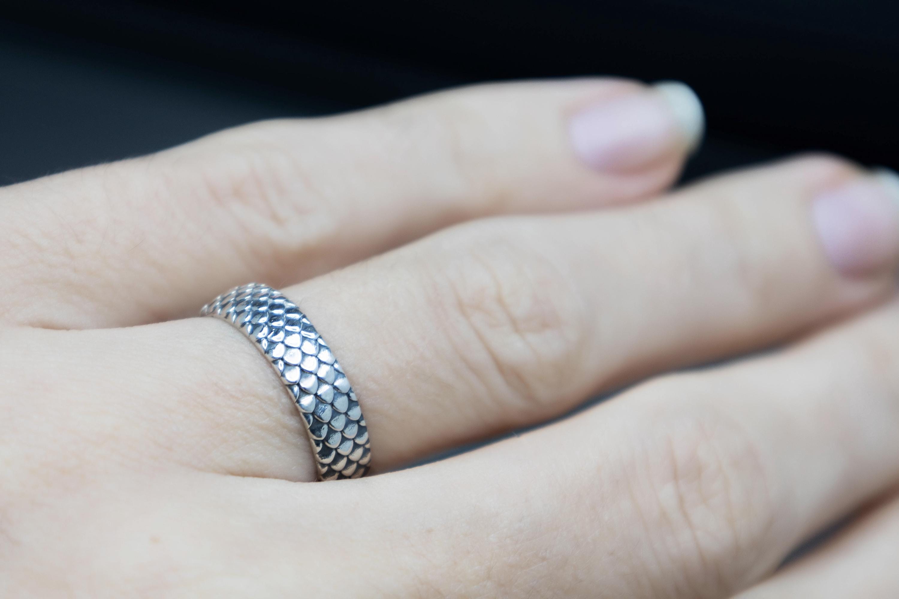 Dragon scale silver ring worn on hand
