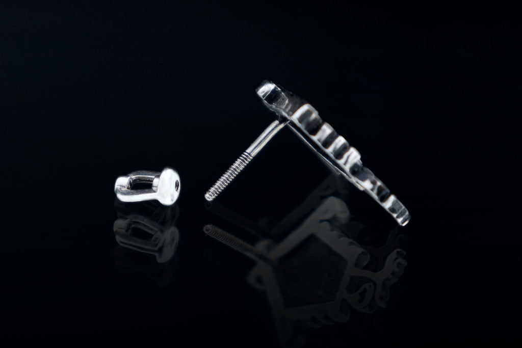 Silver screw back stud earrings detail