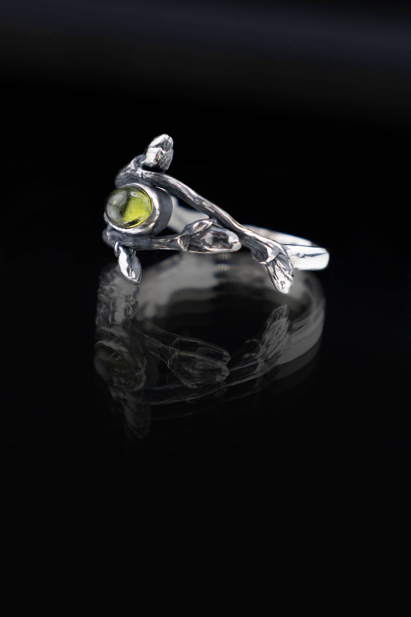 Botanical silver ring with green gemstone