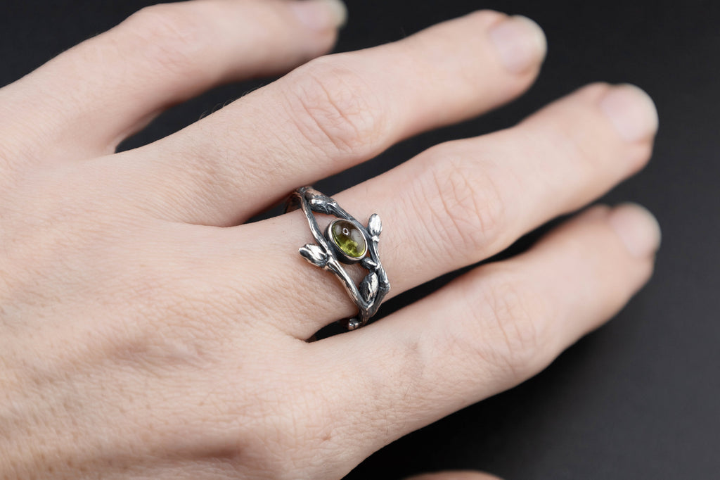 Sterling silver twig ring with green peridot
