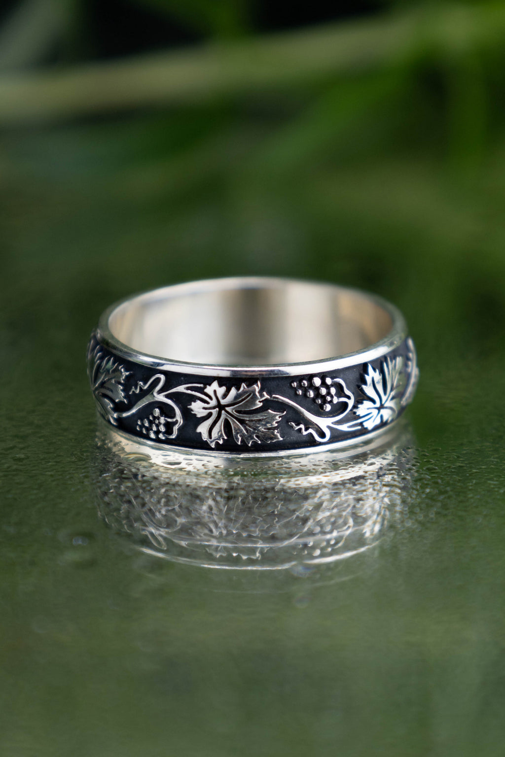 Detailed vineyard leaf ring in oxidized 925 silver, continuous vine and berry solid casting, dark academia style botanical band for women.