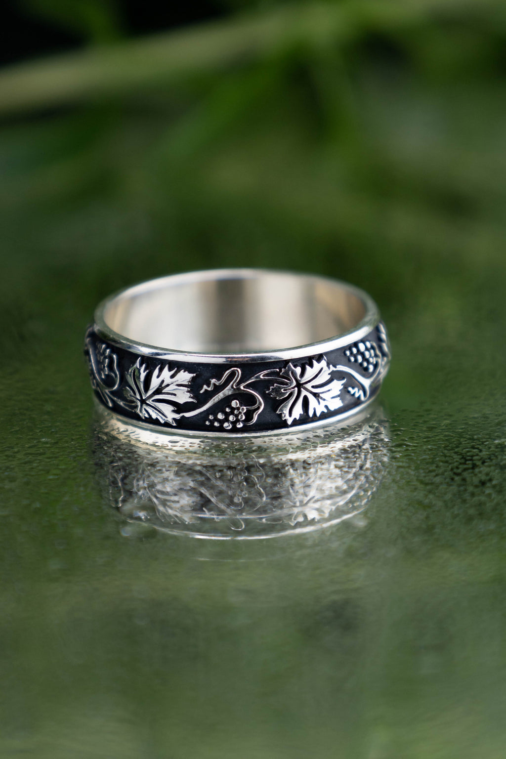 Detailed vineyard leaf ring in oxidized 925 silver, continuous vine and berry solid casting, dark academia style botanical band for women.