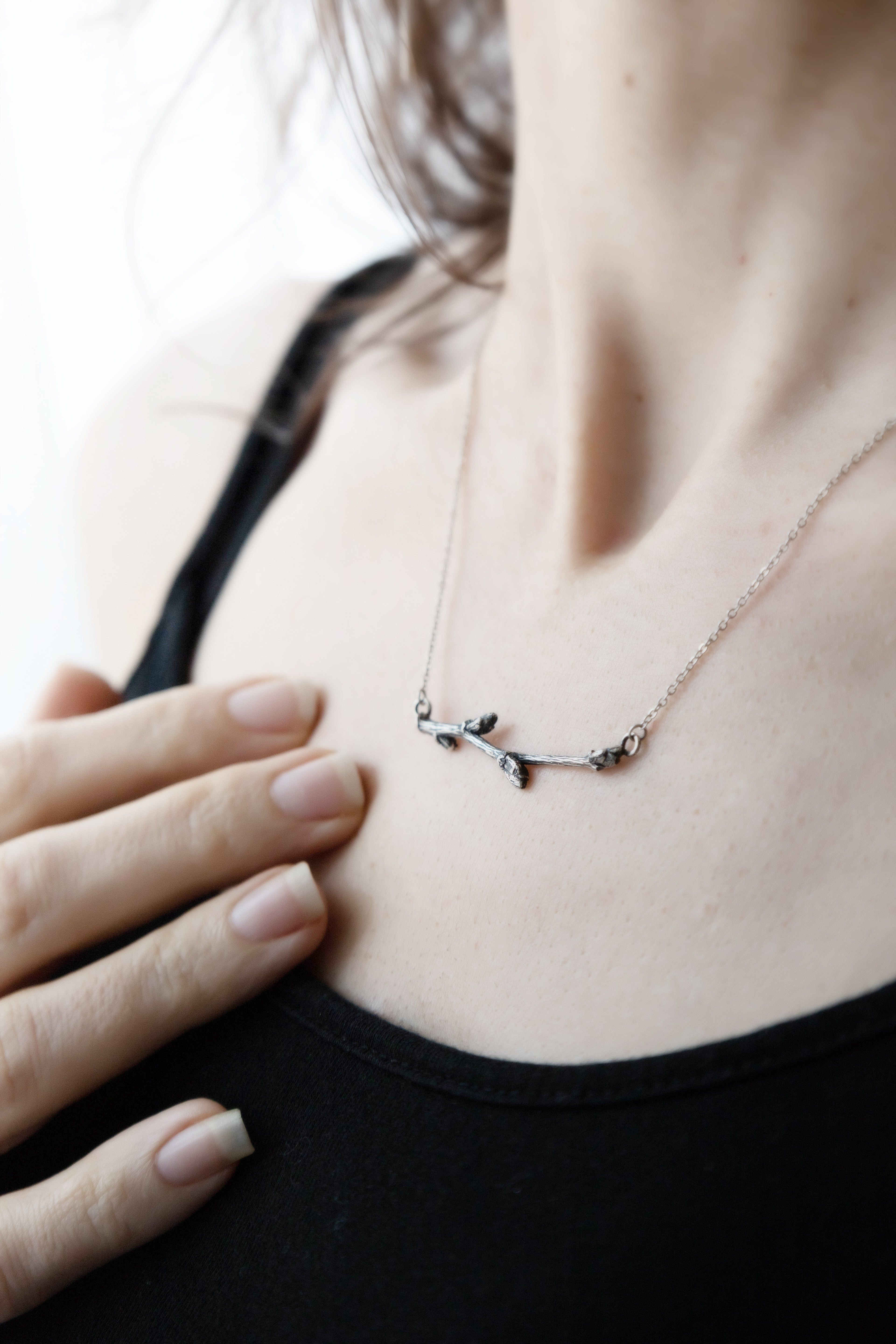 horizontal branch necklace silver on model 