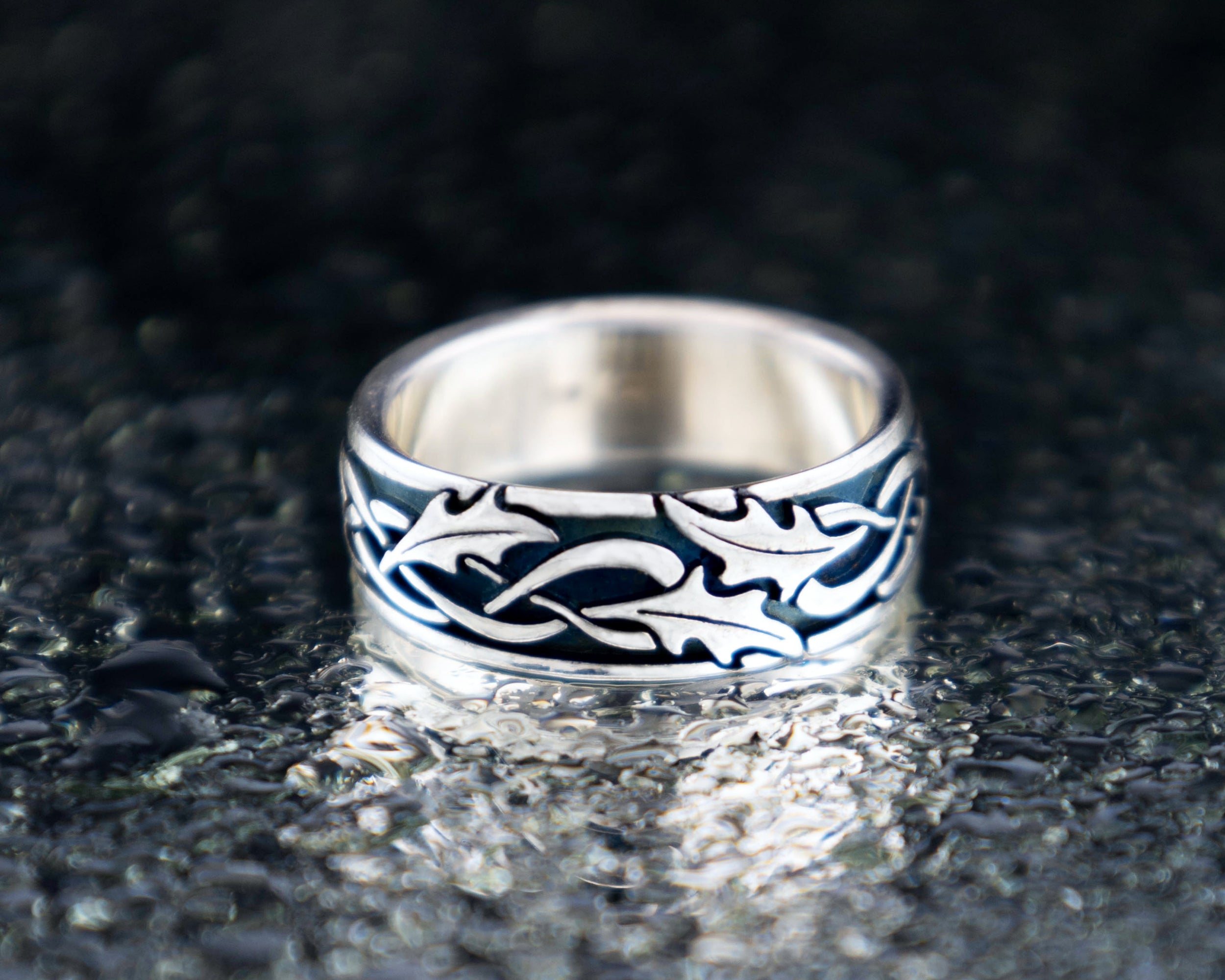 Holly leaf Celtic wedding band in sterling silver, oxidized texture with detailed leaf pattern