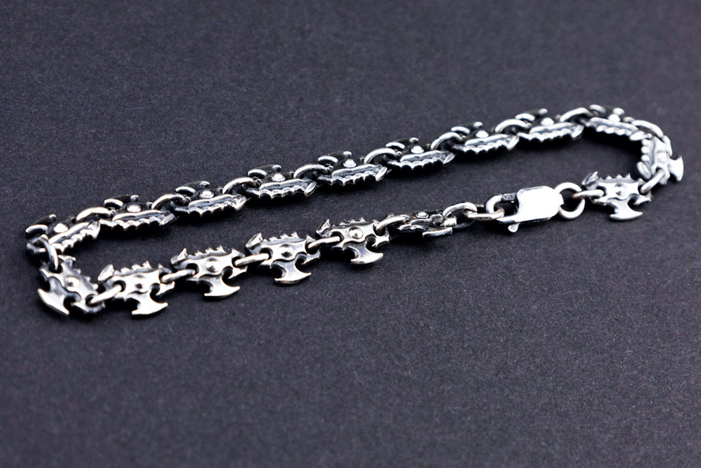 Full view of oxidized 925 silver chainsaw chain bracelet with lobster clasp