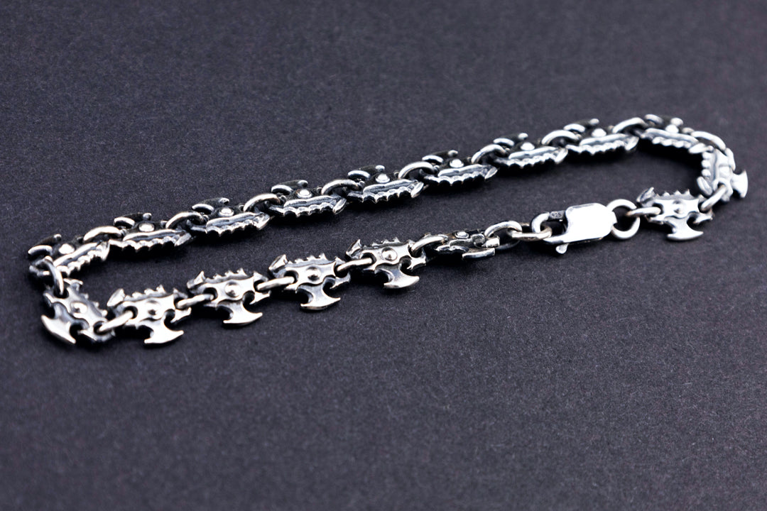 Full view of oxidized 925 silver chainsaw chain bracelet with lobster clasp