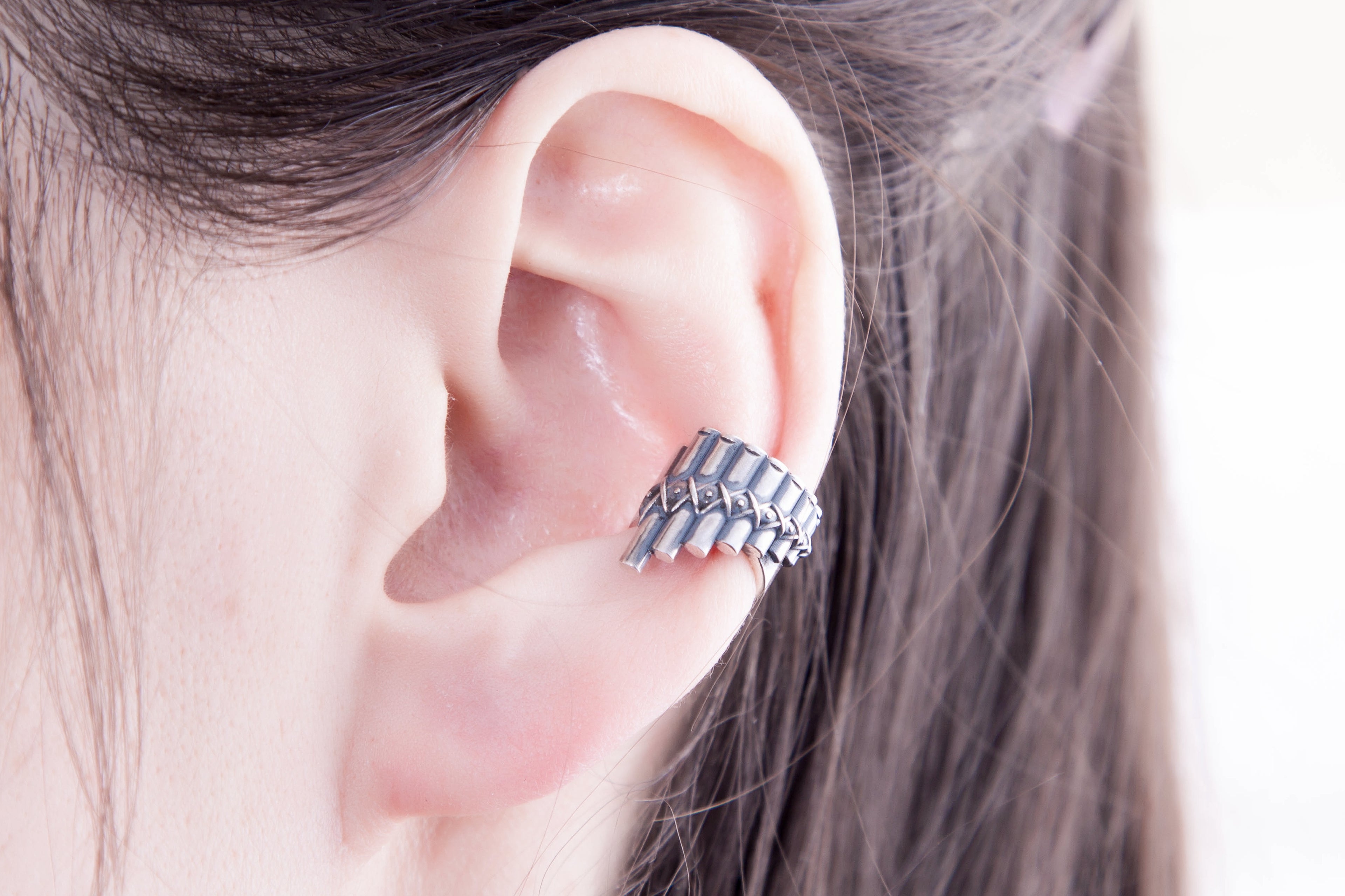 Sterling silver pan flute ear cuff worn on ear, no piercing jewelry