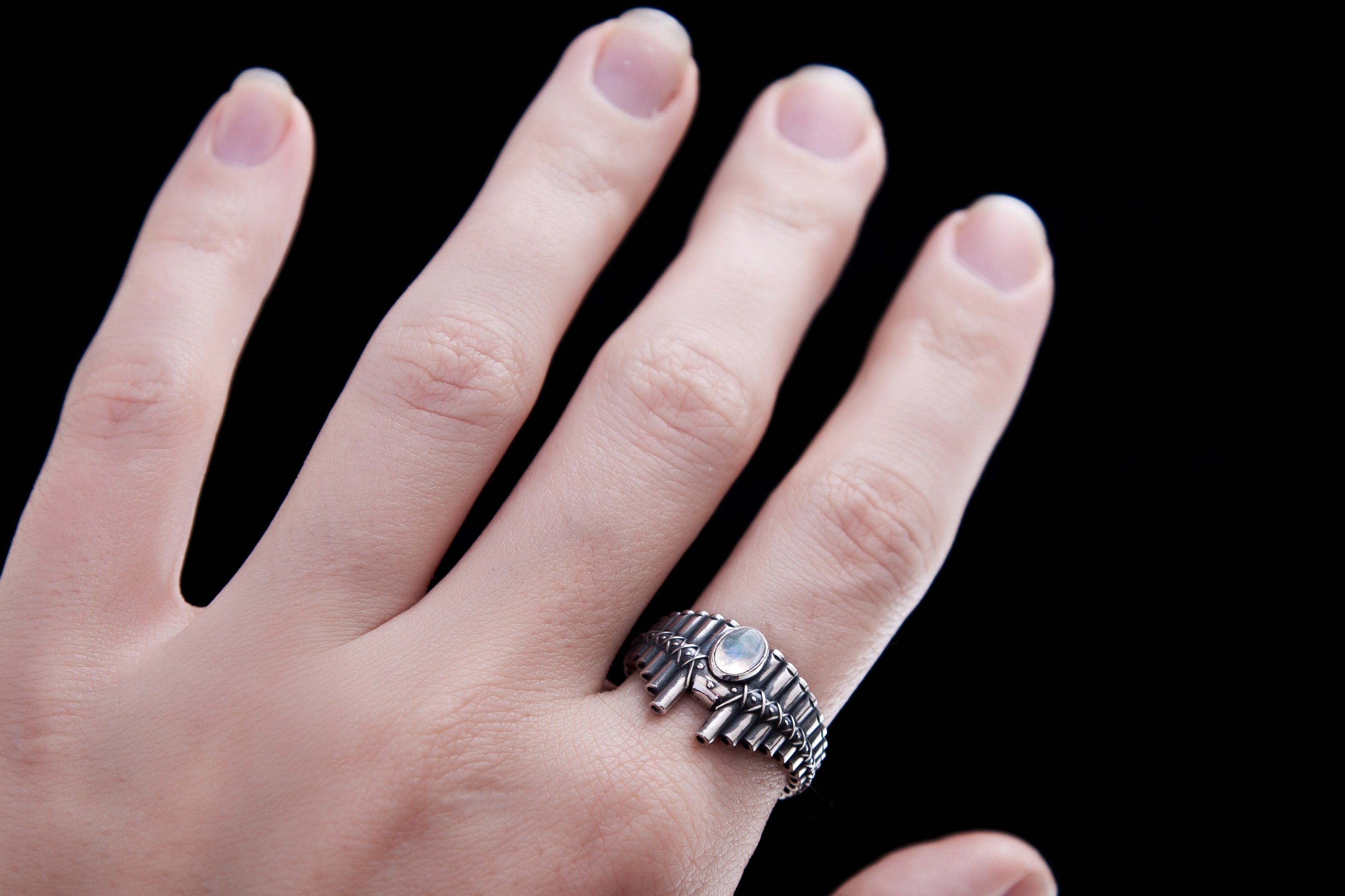 Sculptural Pan Flute ring wrapping around finger, handmade silver jewelry