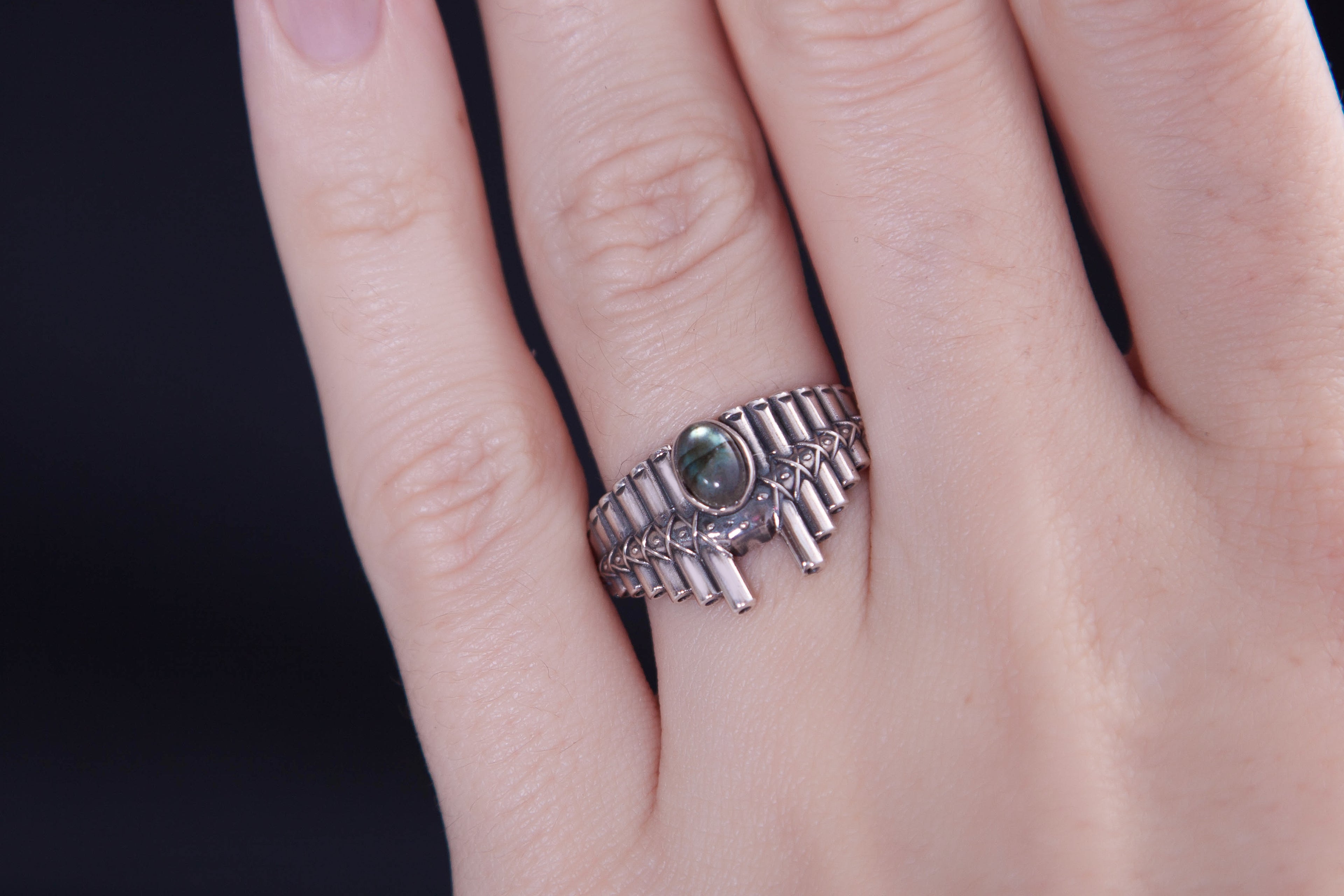 Pan Flute inspired silver ring worn on hand, bold statement design