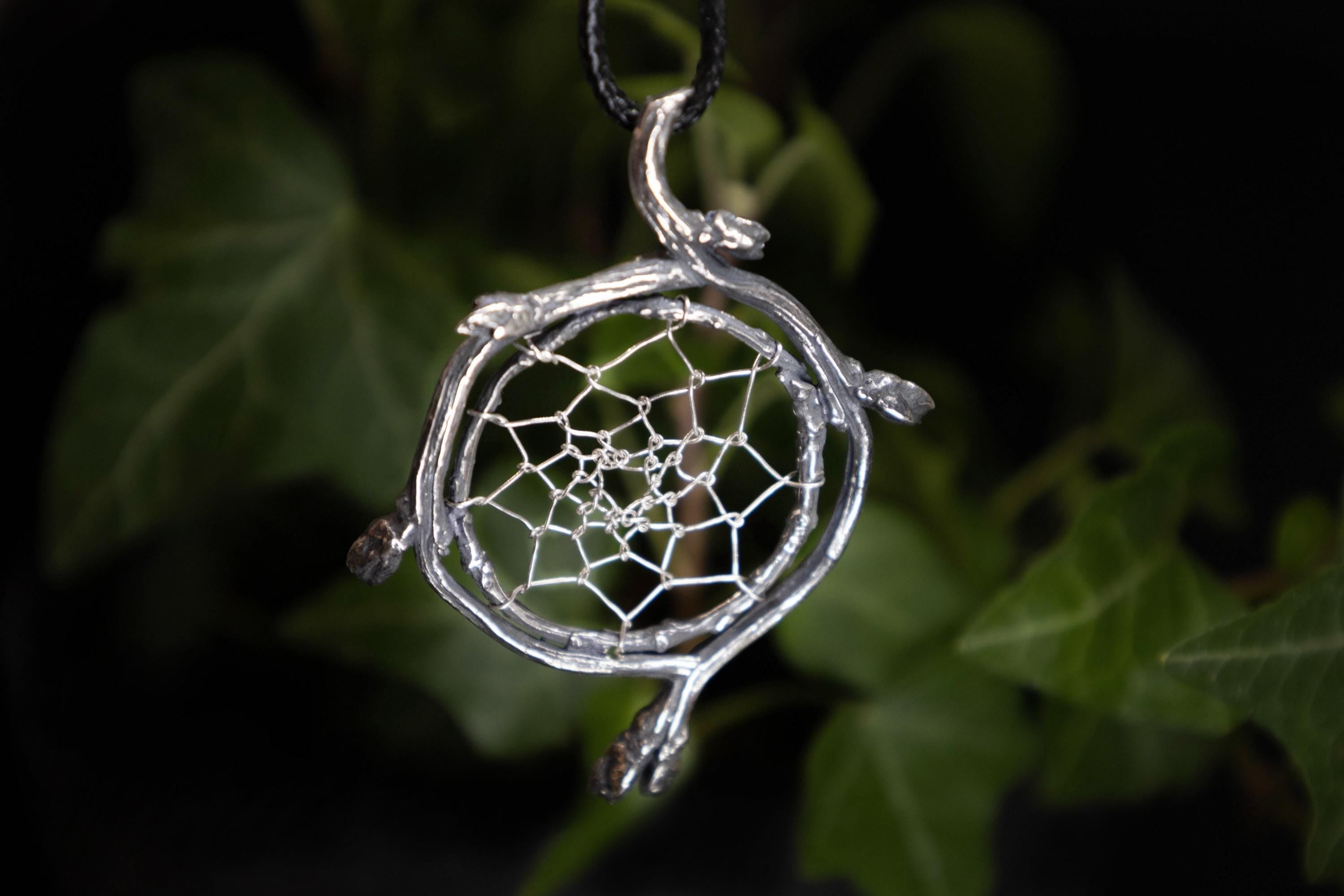 Handmade silver dreamcatcher amulet with woven web detail