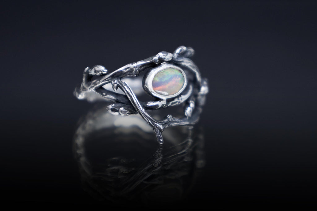 Elven style silver branch ring with glowing opal gemstone