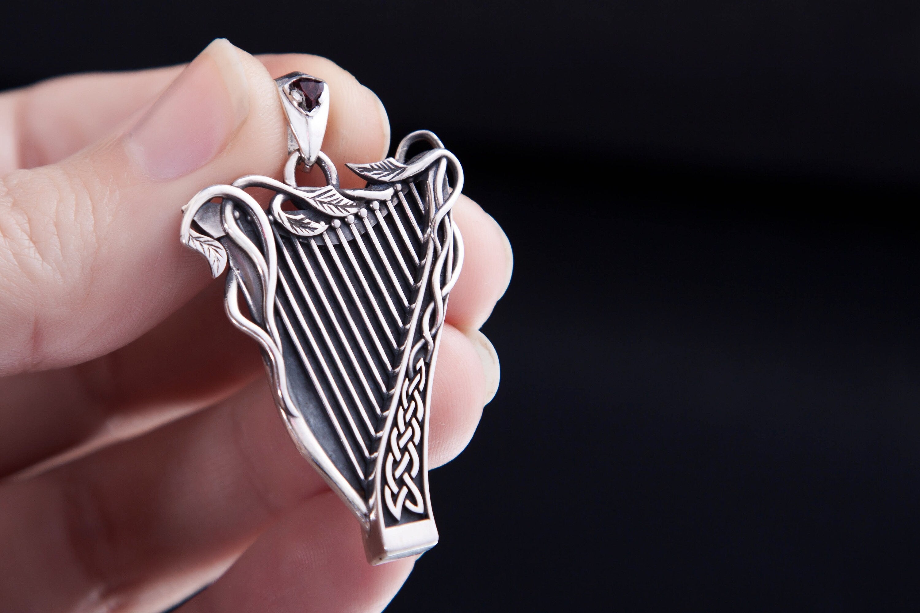 Handcrafted silver harp charm with garnet