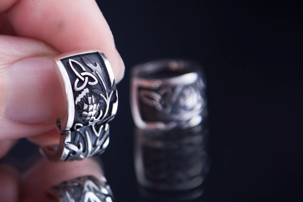 Wide sterling silver hoop with thistle carving