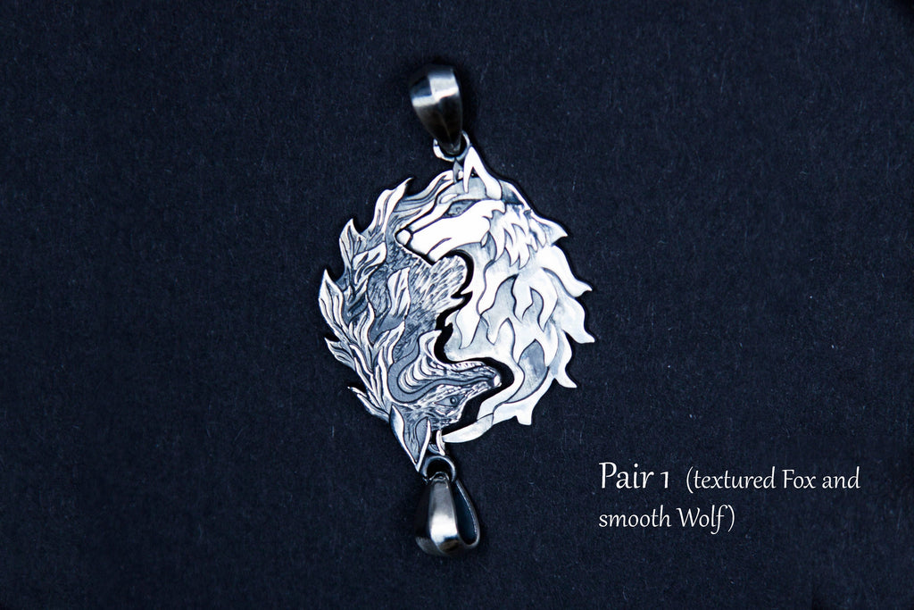 Silver pendant set with wolf and fox design, textured version