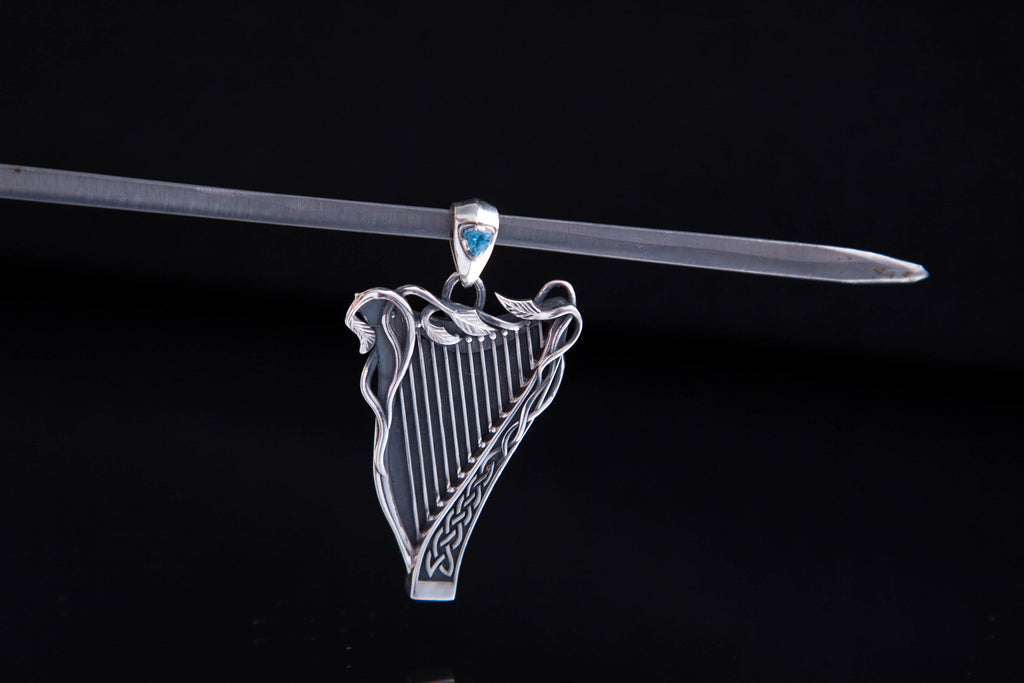 Detailed silver Celtic harp pendant with gemstone options
