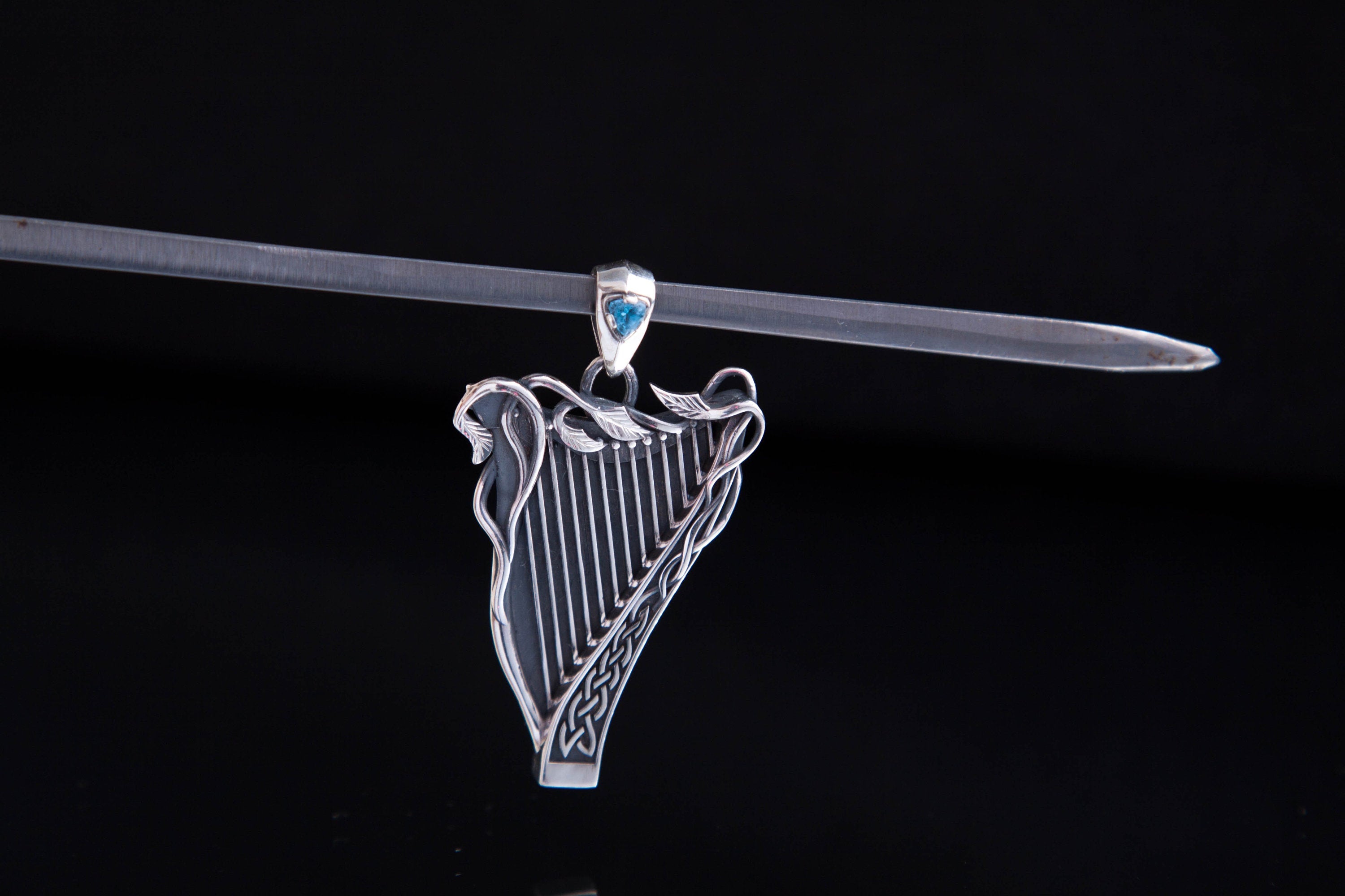 Detailed silver Celtic harp pendant with gemstone options