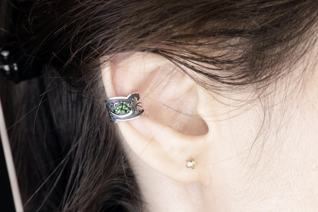 Green stone botanical ear cuff on model