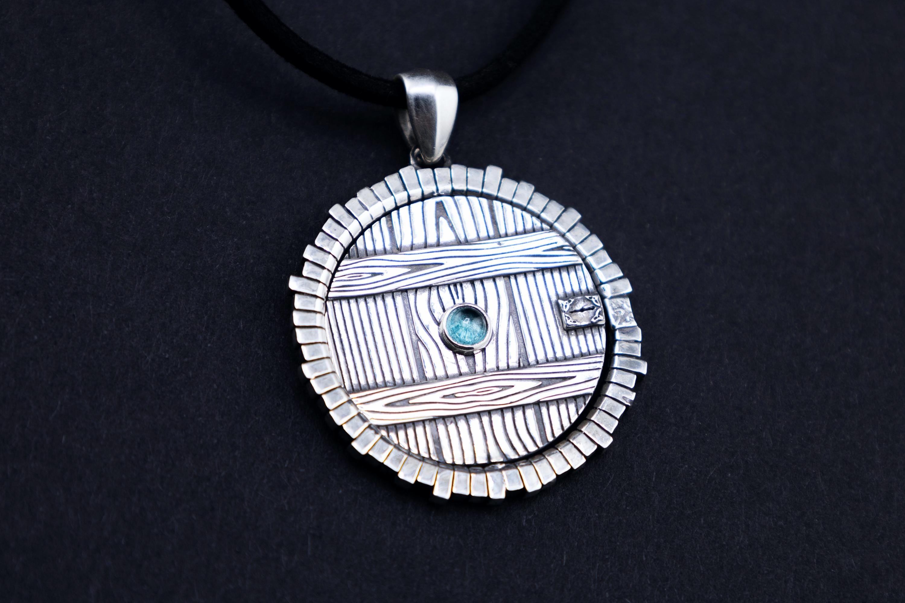Fantasy necklace with rotating center, sterling silver hobbit door