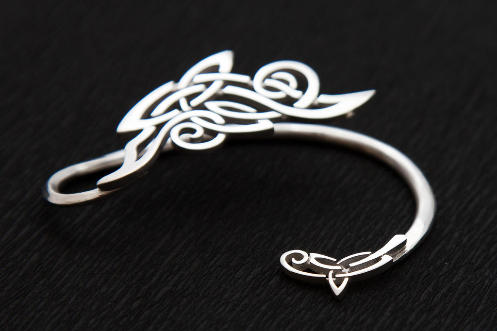 Close-up of handcrafted silver ear wrap, Celtic and winter frosts pattern style