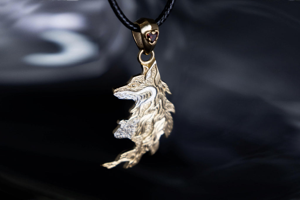 Gold plated fox pendant with garnet stone
