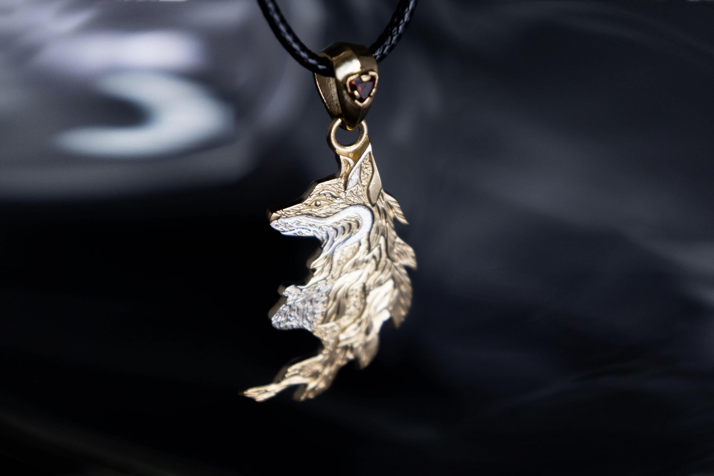 Gold plated fox pendant with garnet stone
