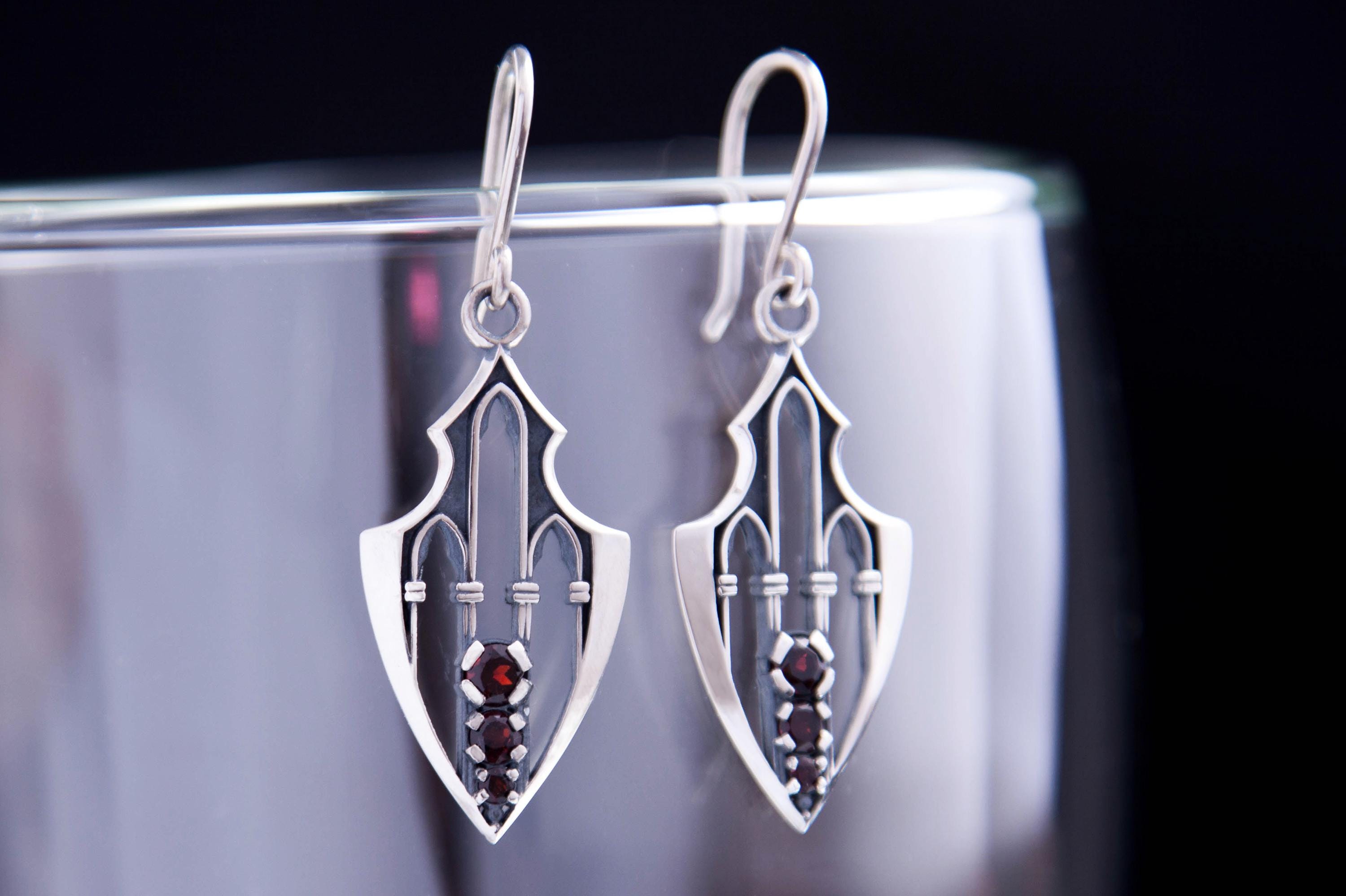 Gothic silver earrings with cathedral arches and three garnets