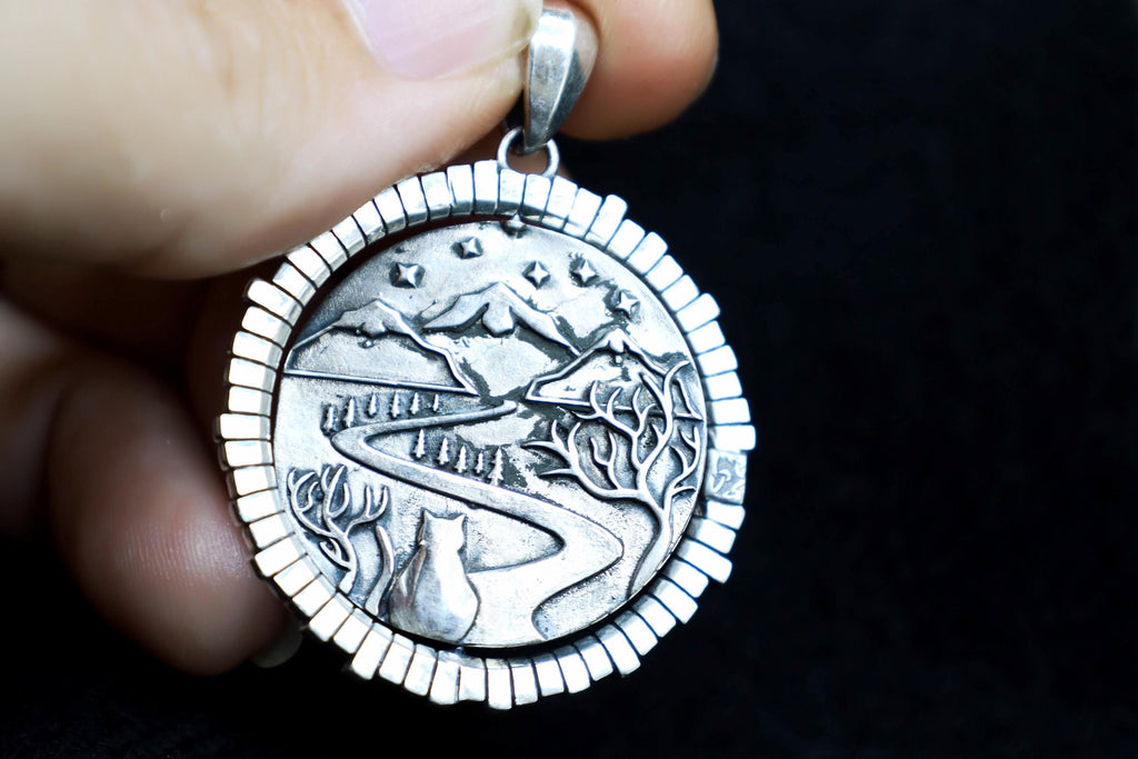 Spinning symbolic door pendant with natural gemstone