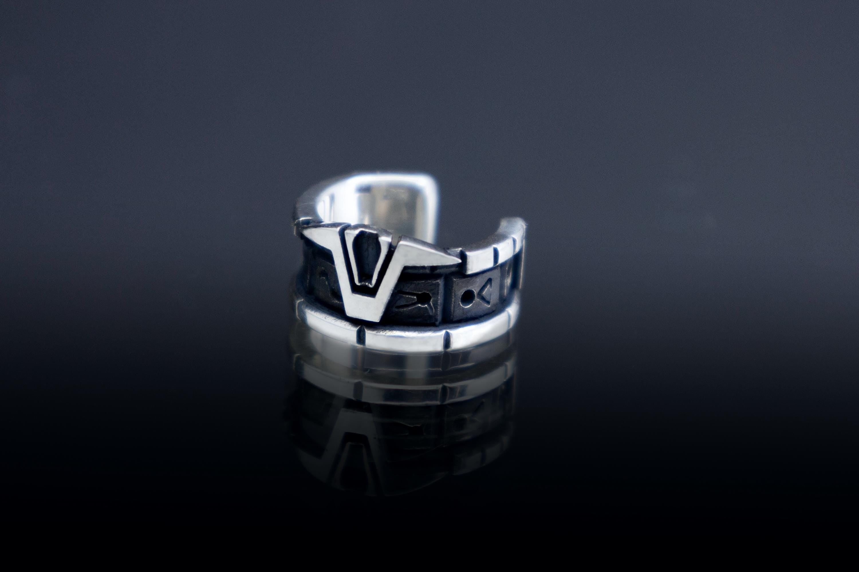 silver ear cuff with Star Gate glyphs