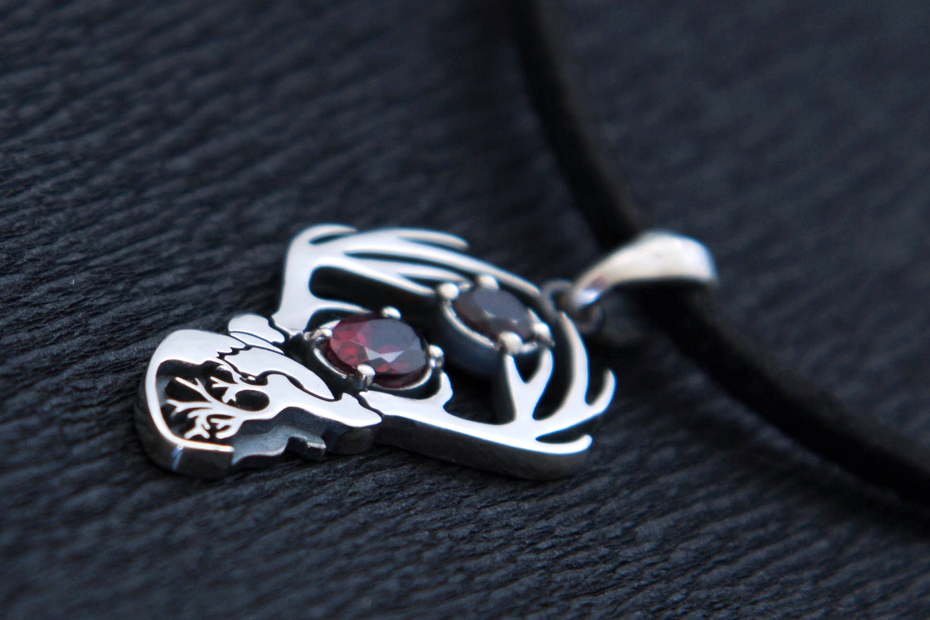 Silver Hannigram-inspired stag pendant with natural garnets, dark romantic charm
