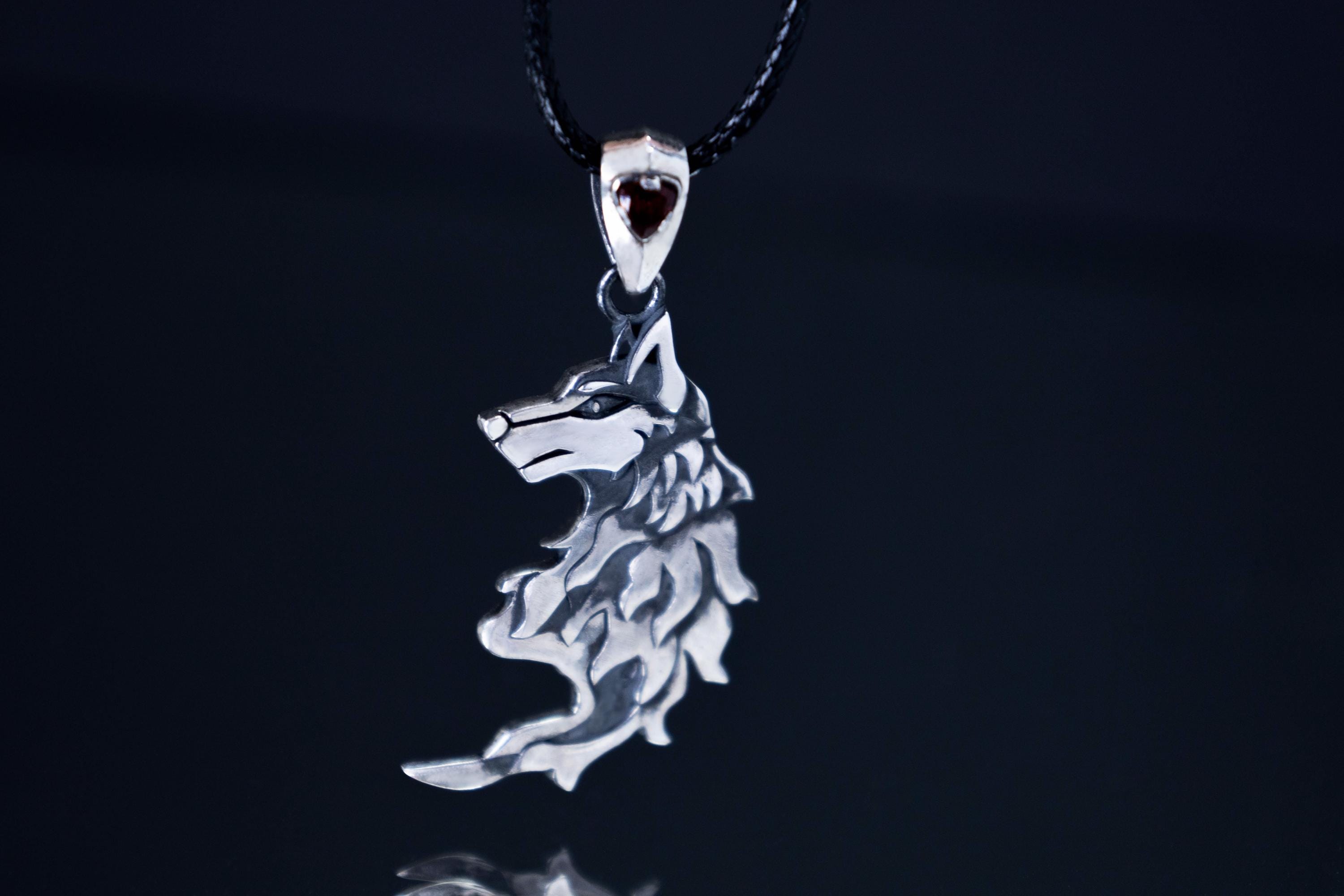 Wolf silver pendant with garnet