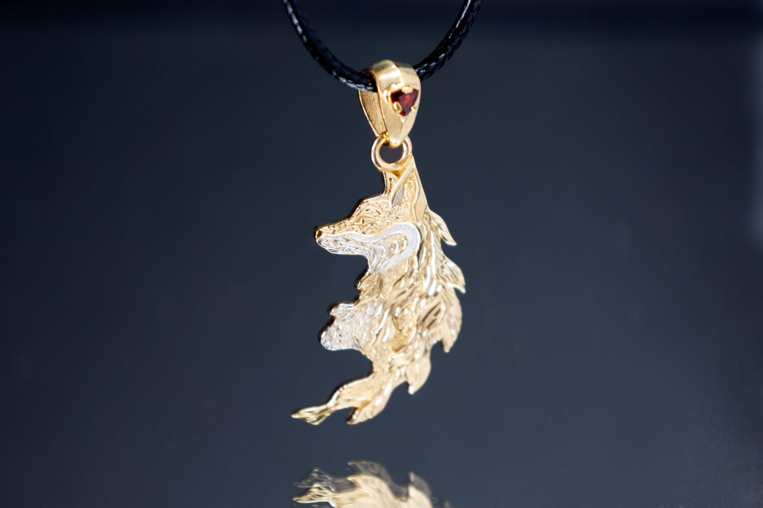 Gold plated fox pendant with garnet stone