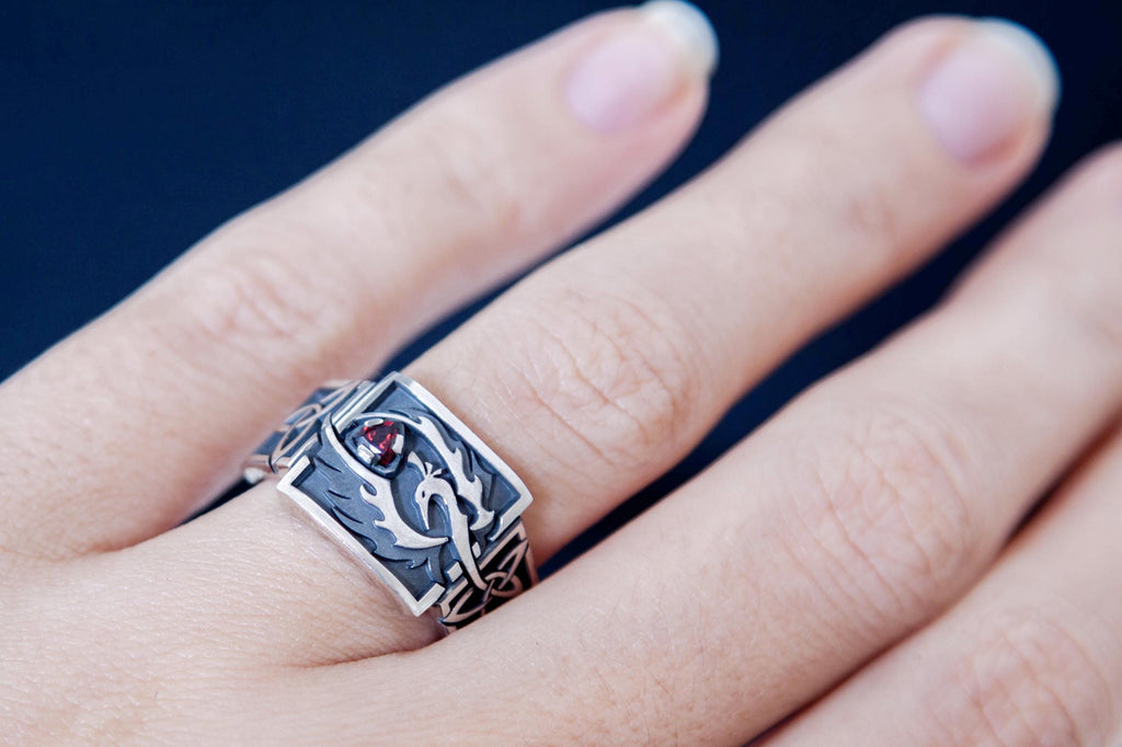 Handmade Celtic phoenix signet ring on hand