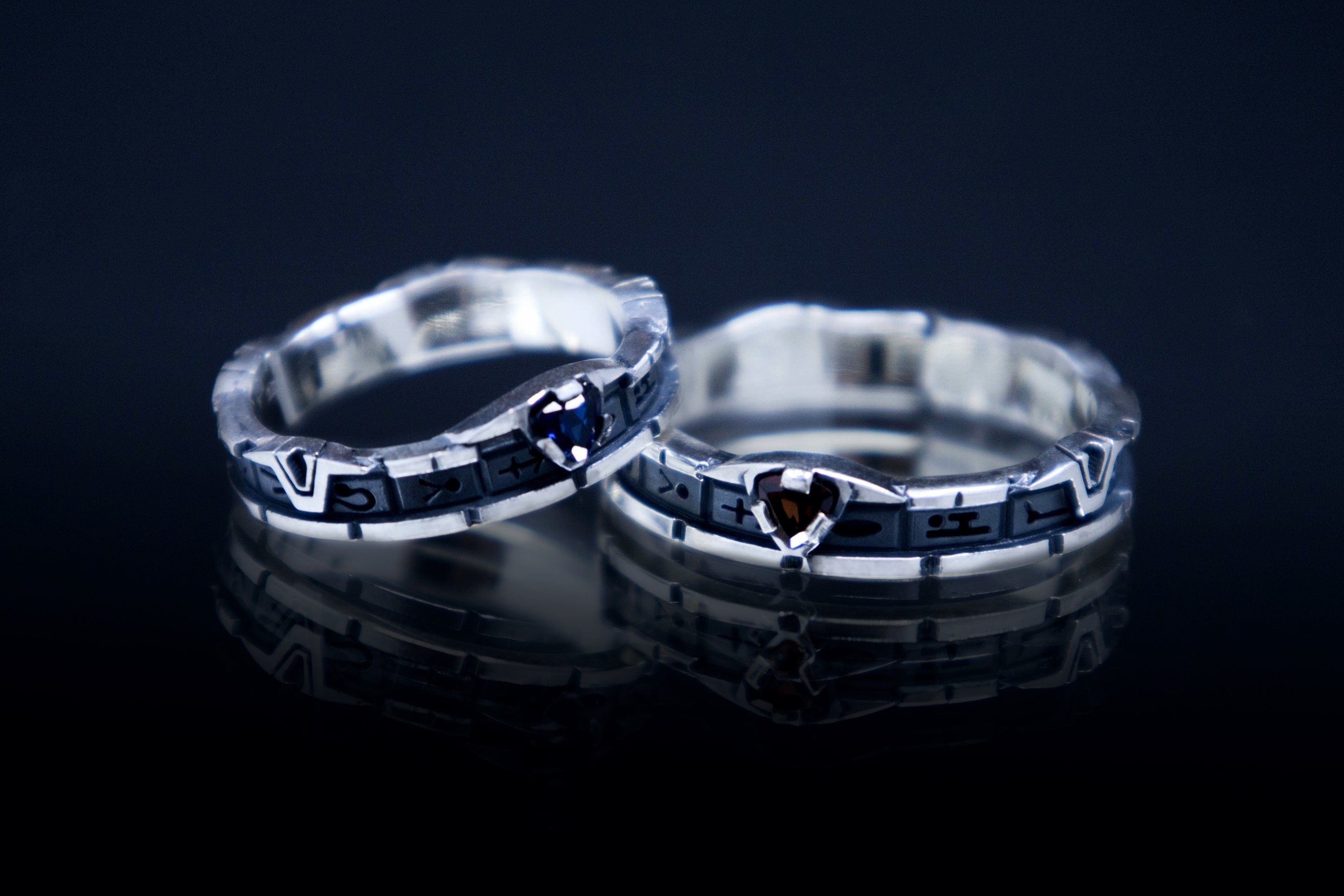 Stargate ring with garnet or blue c.z