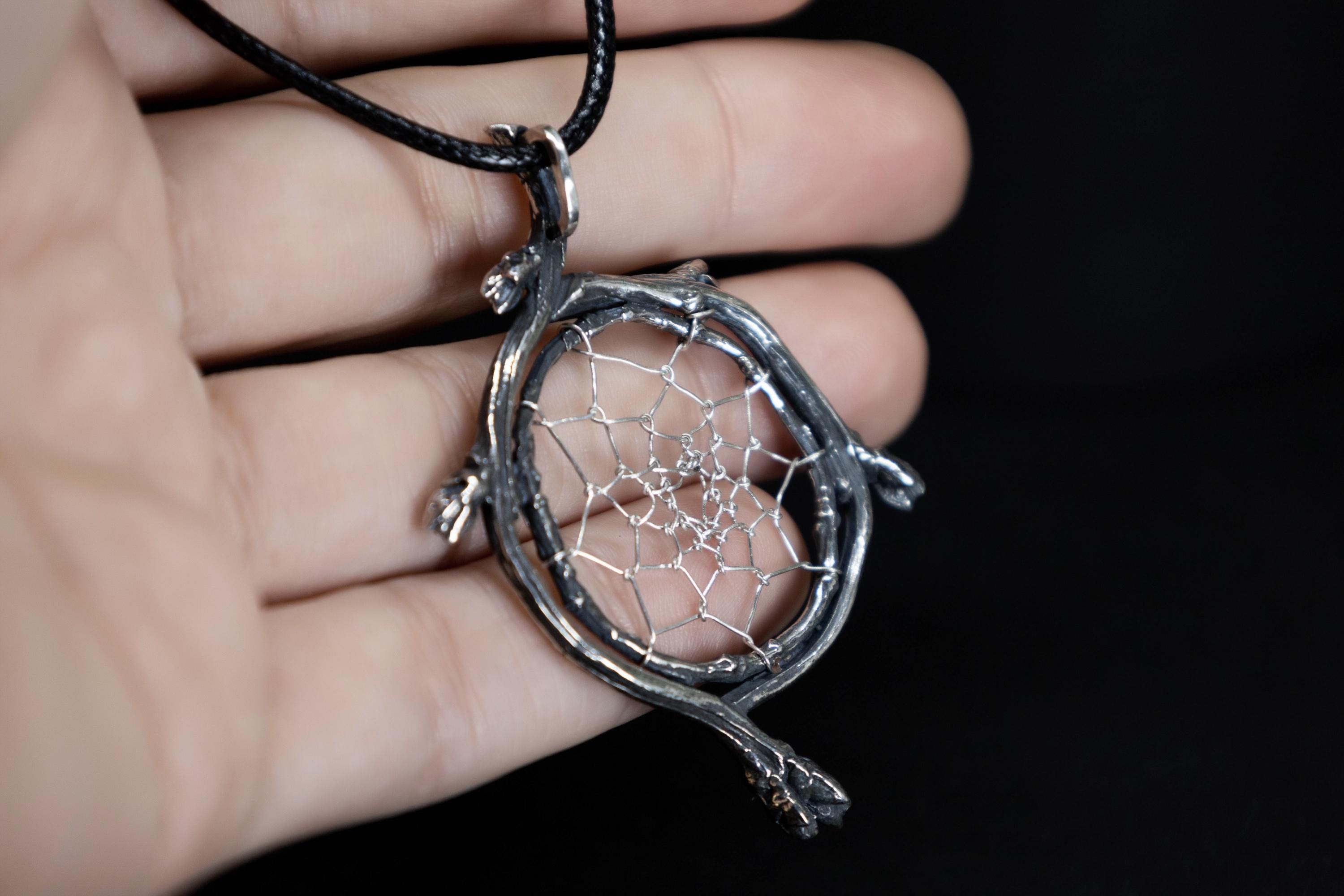 Woodland magic silver pendant held in hand, organic design