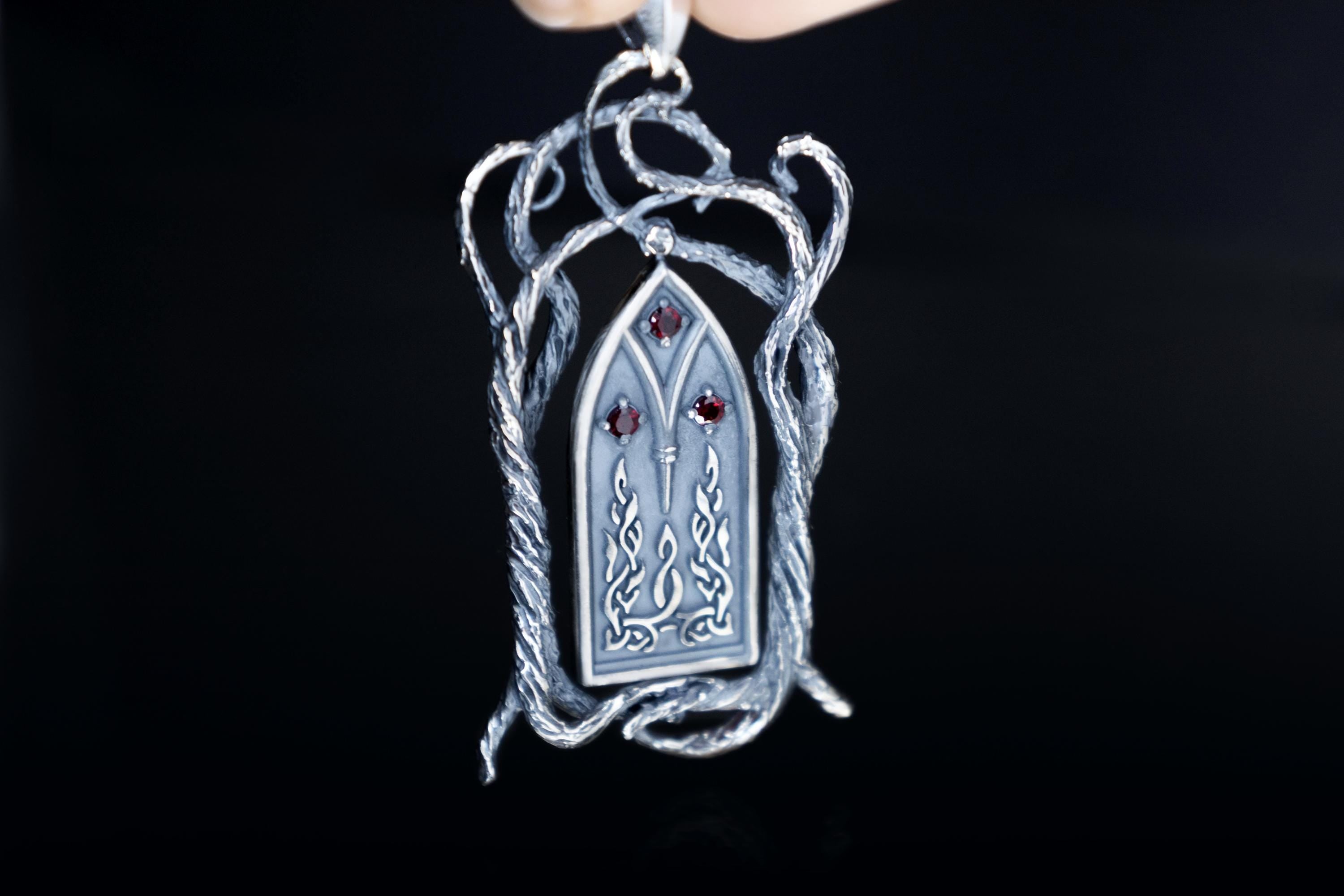 Silver fantasy necklace with garnet accents