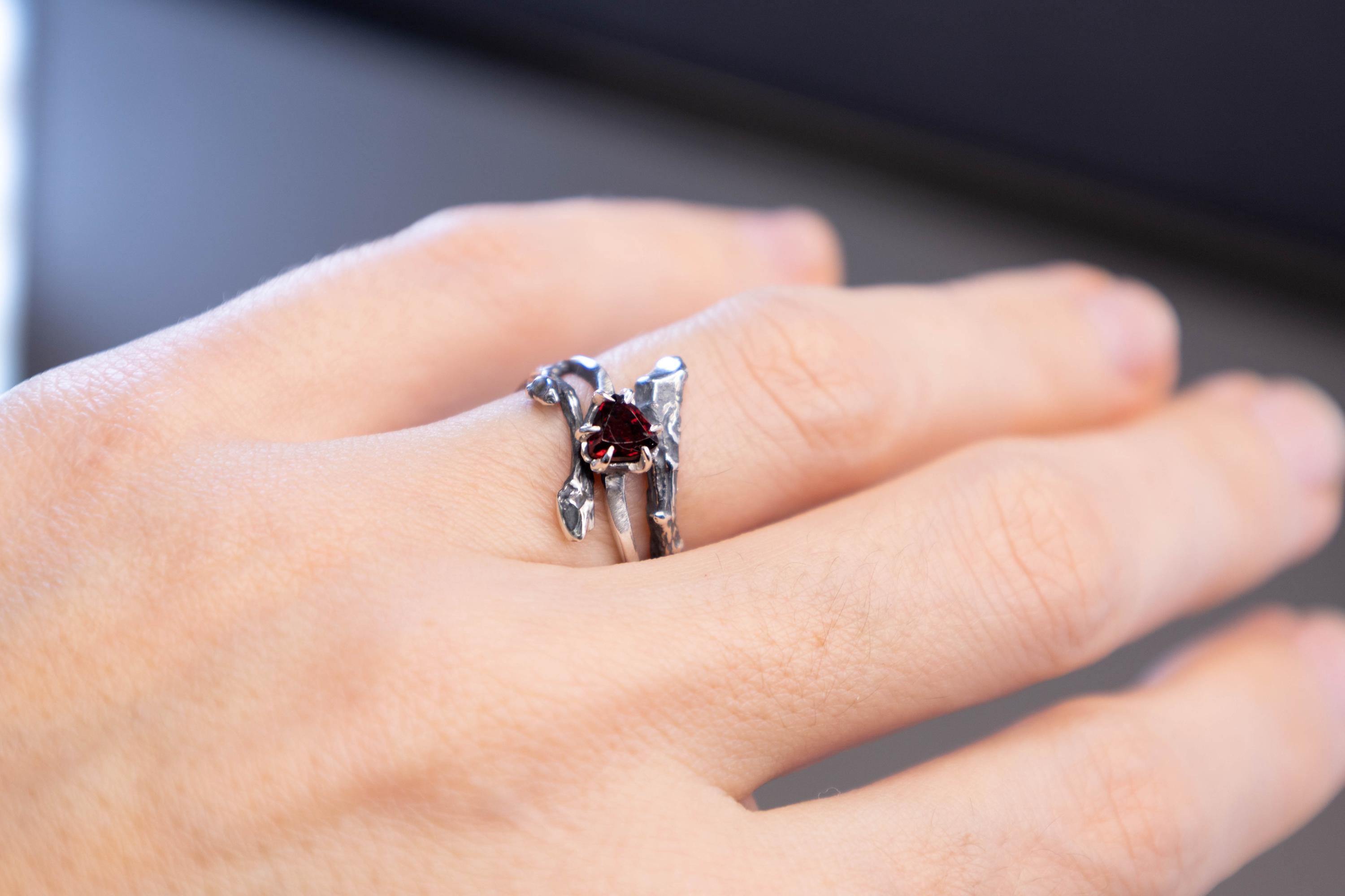 Garnet twig ring on hand, natural branch texture