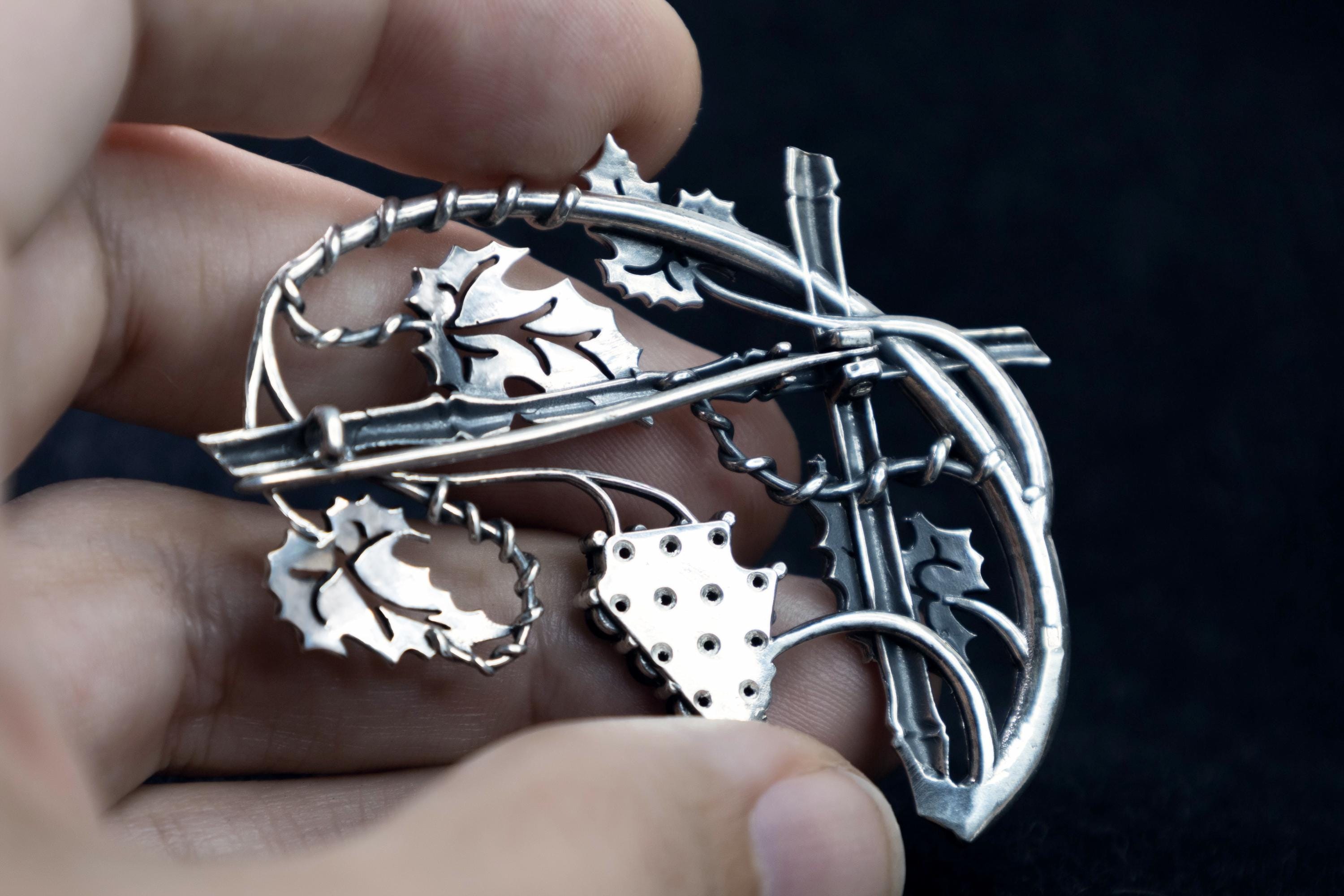 Back view of sterling silver grape leaves and garnet cluster brooch