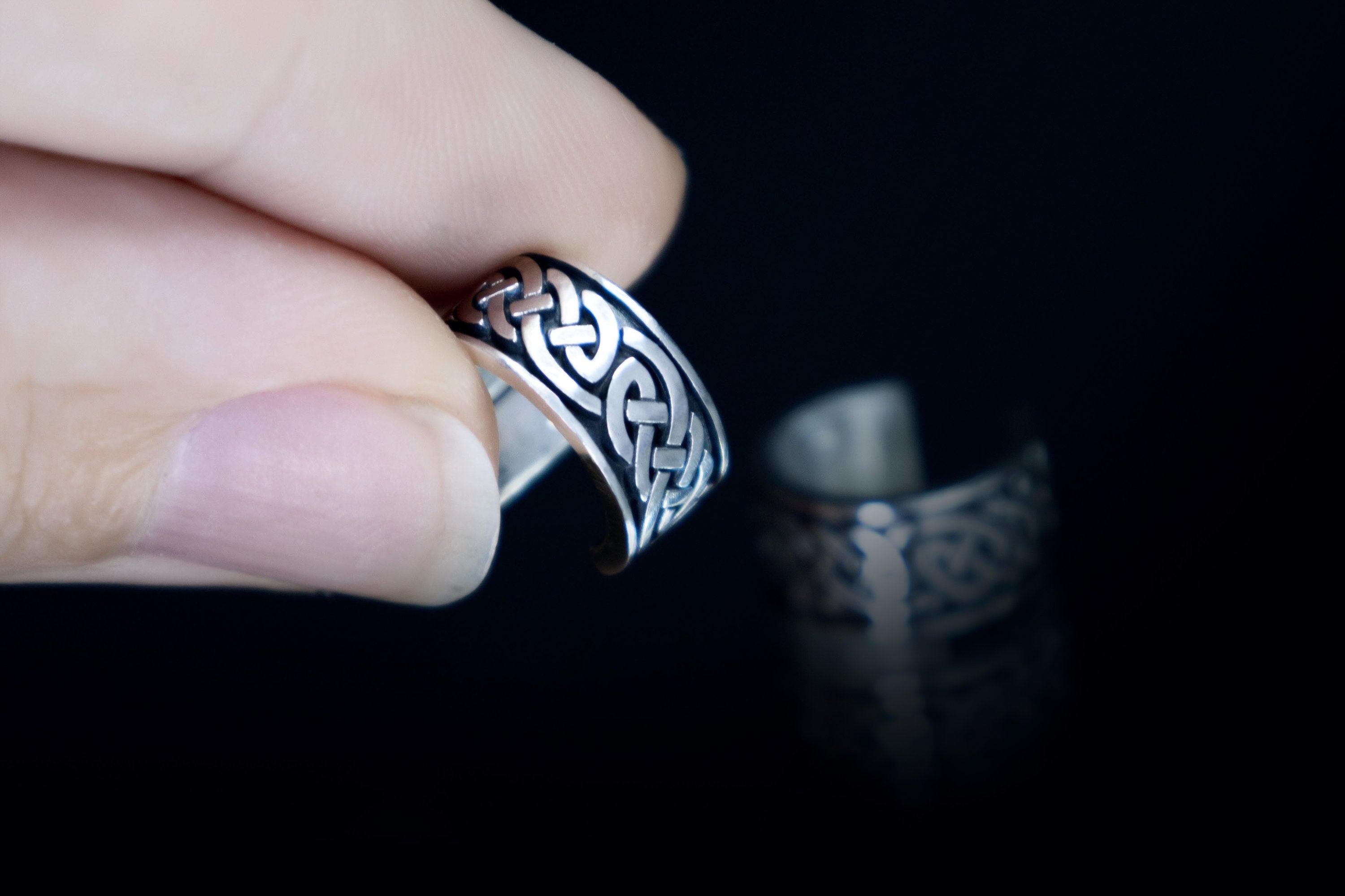 Celtic ear cuff shown in hand for scale