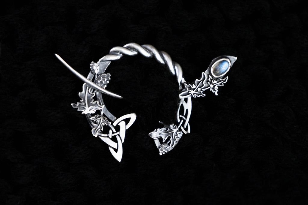 Silver Celtic fibula brooch with hop and ivy leaves