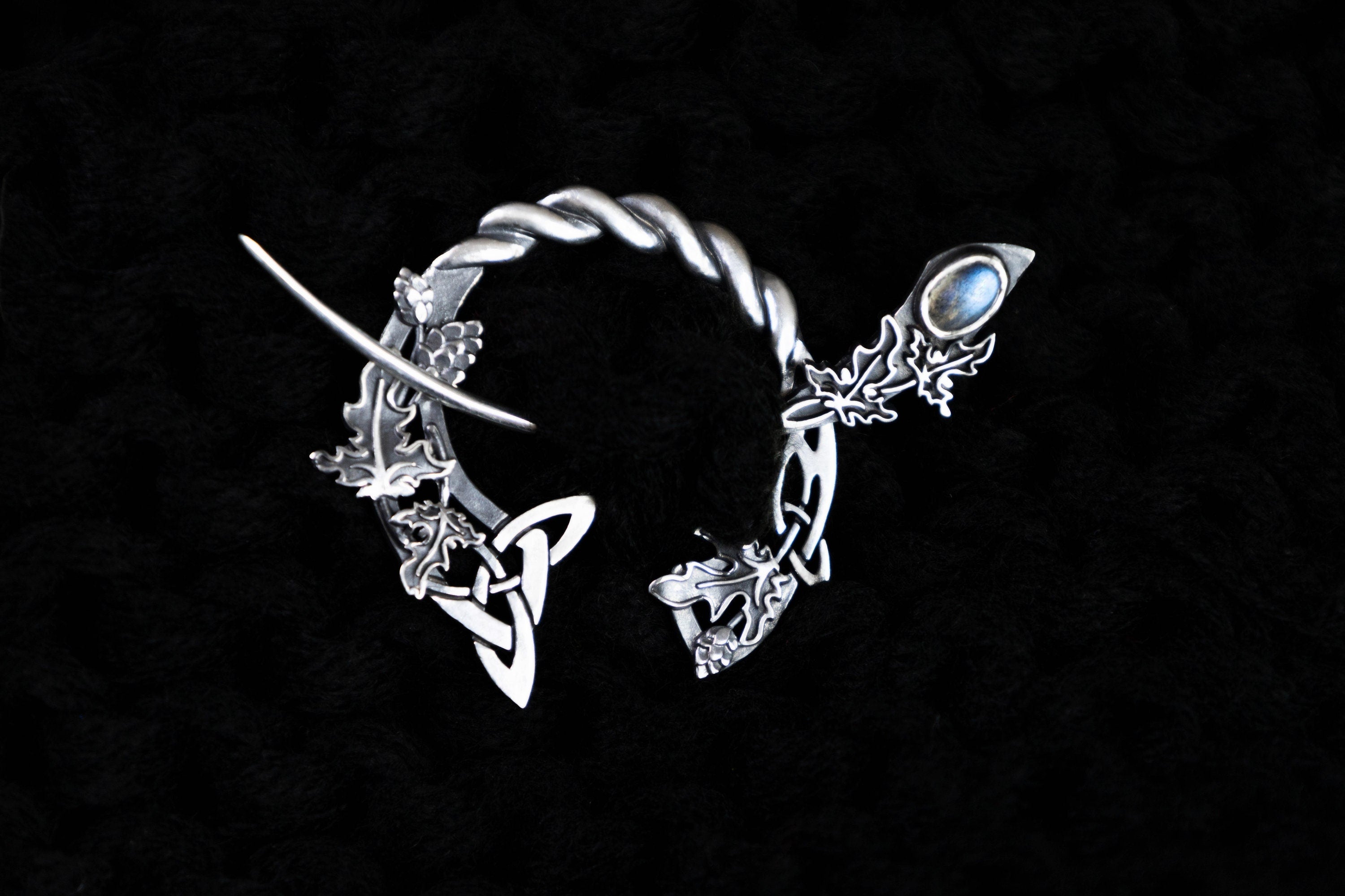 Silver Celtic fibula brooch with hop and ivy leaves