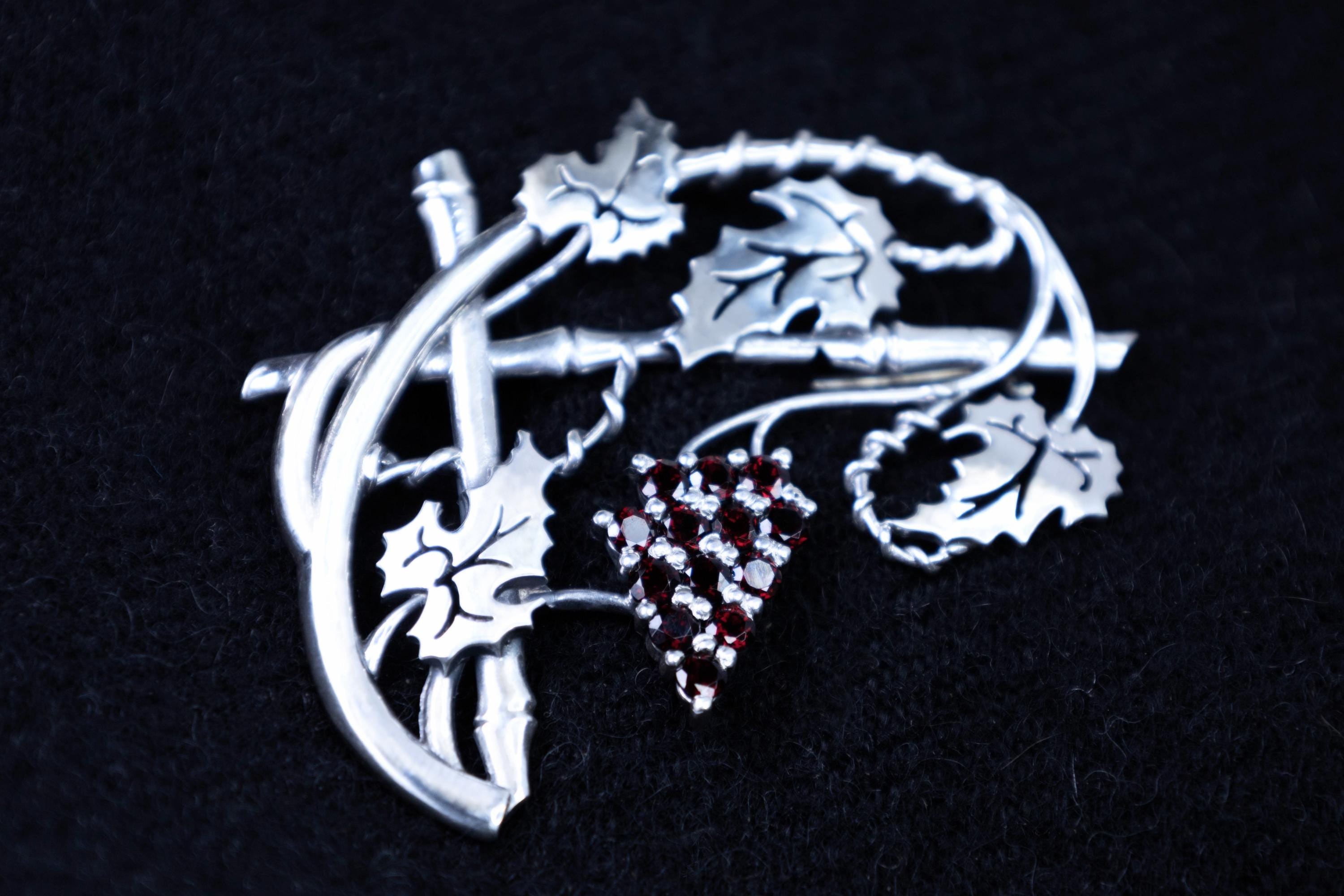 Elegant botanical brooch with red garnets, handmade silver jewelry